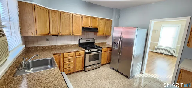 a view of a hallway with washer and dryer