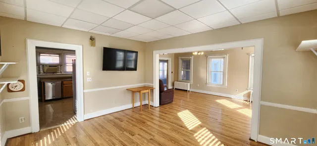 a kitchen with granite countertop a stove and a sink