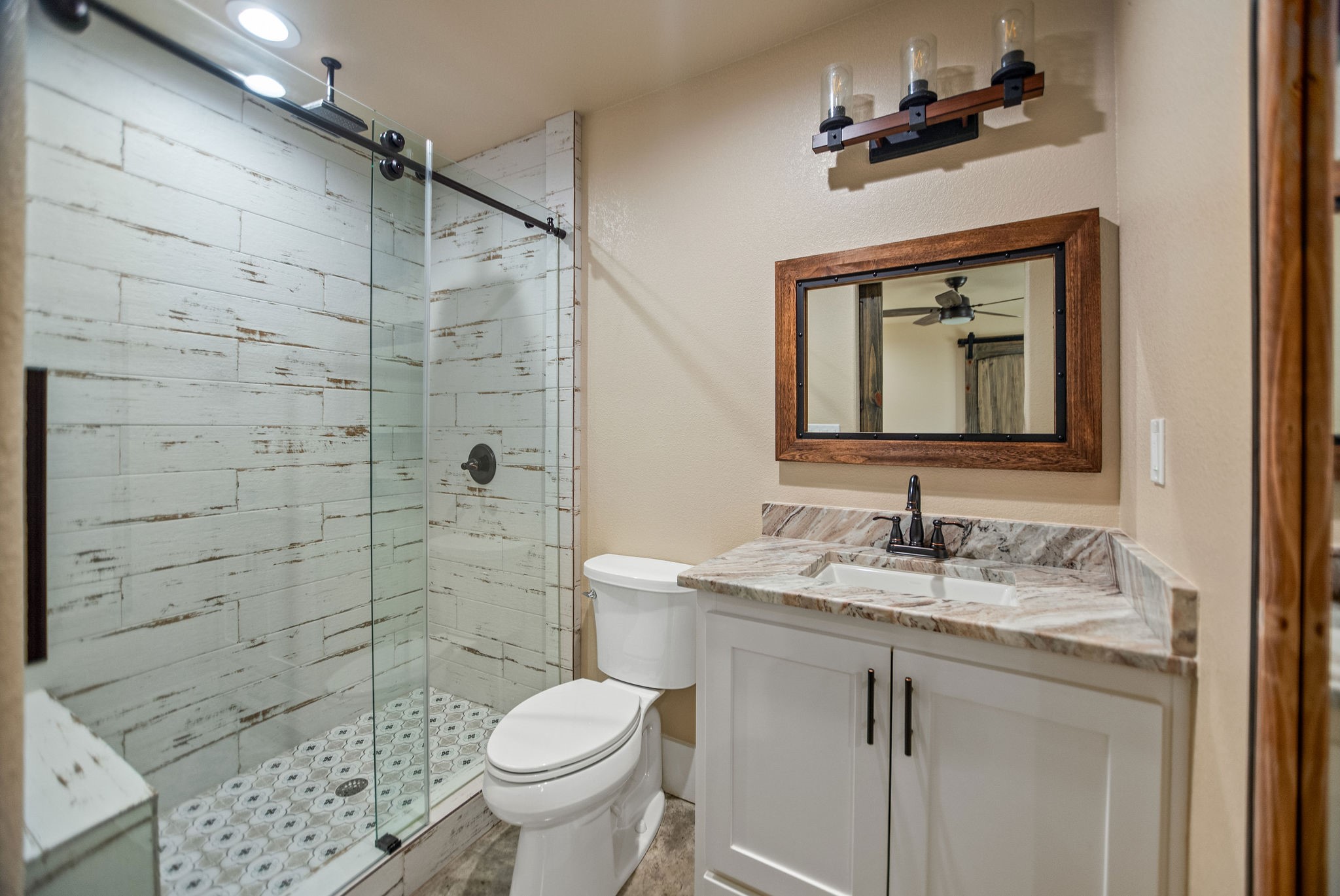 82 Circle Hook Port O'Connor, TX 77982 - Photo 20 of 32 a bathroom with a toilet sink and mirror