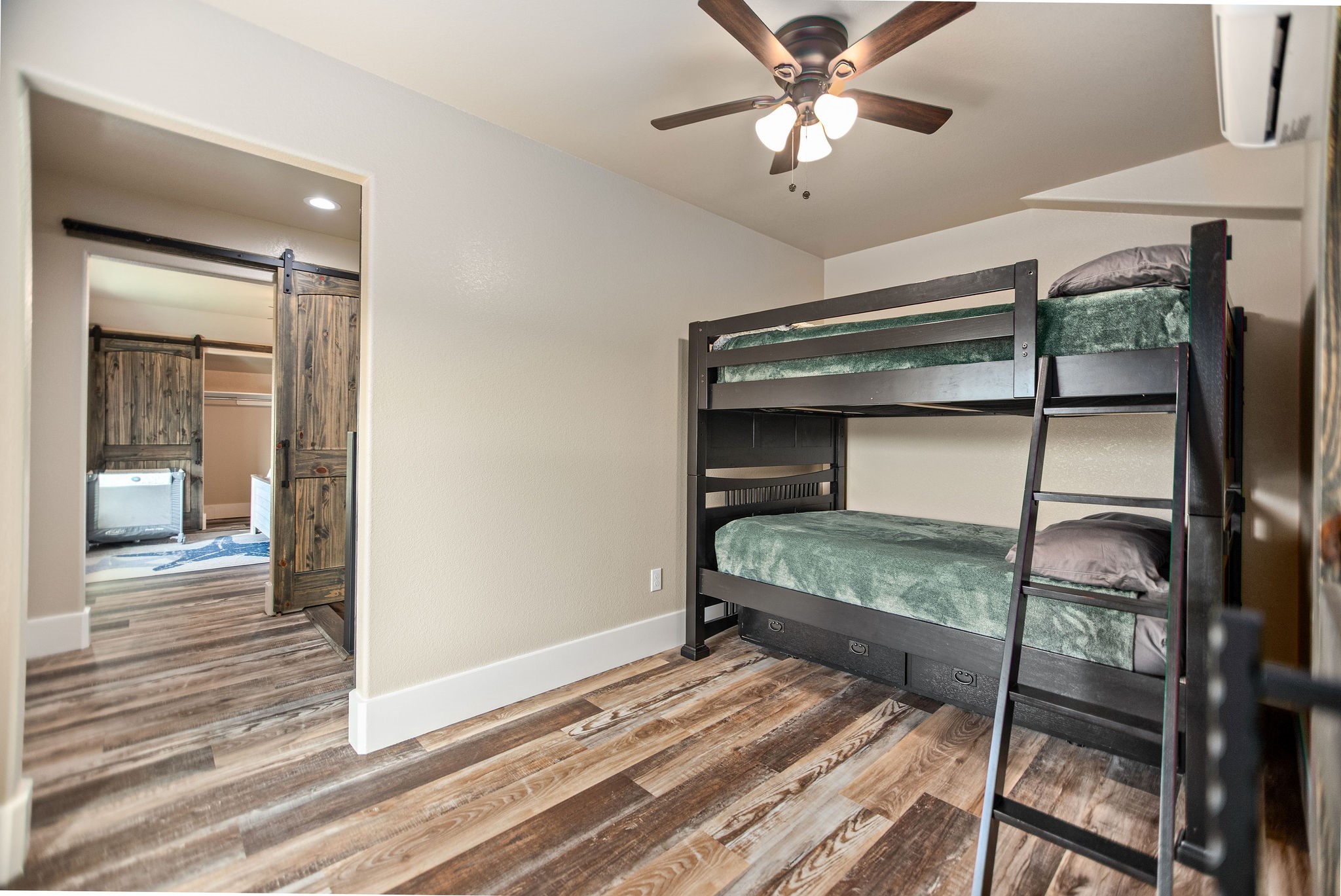 82 Circle Hook Port O'Connor, TX 77982 - Photo 23 of 32 a bedroom with a bed and a chandelier