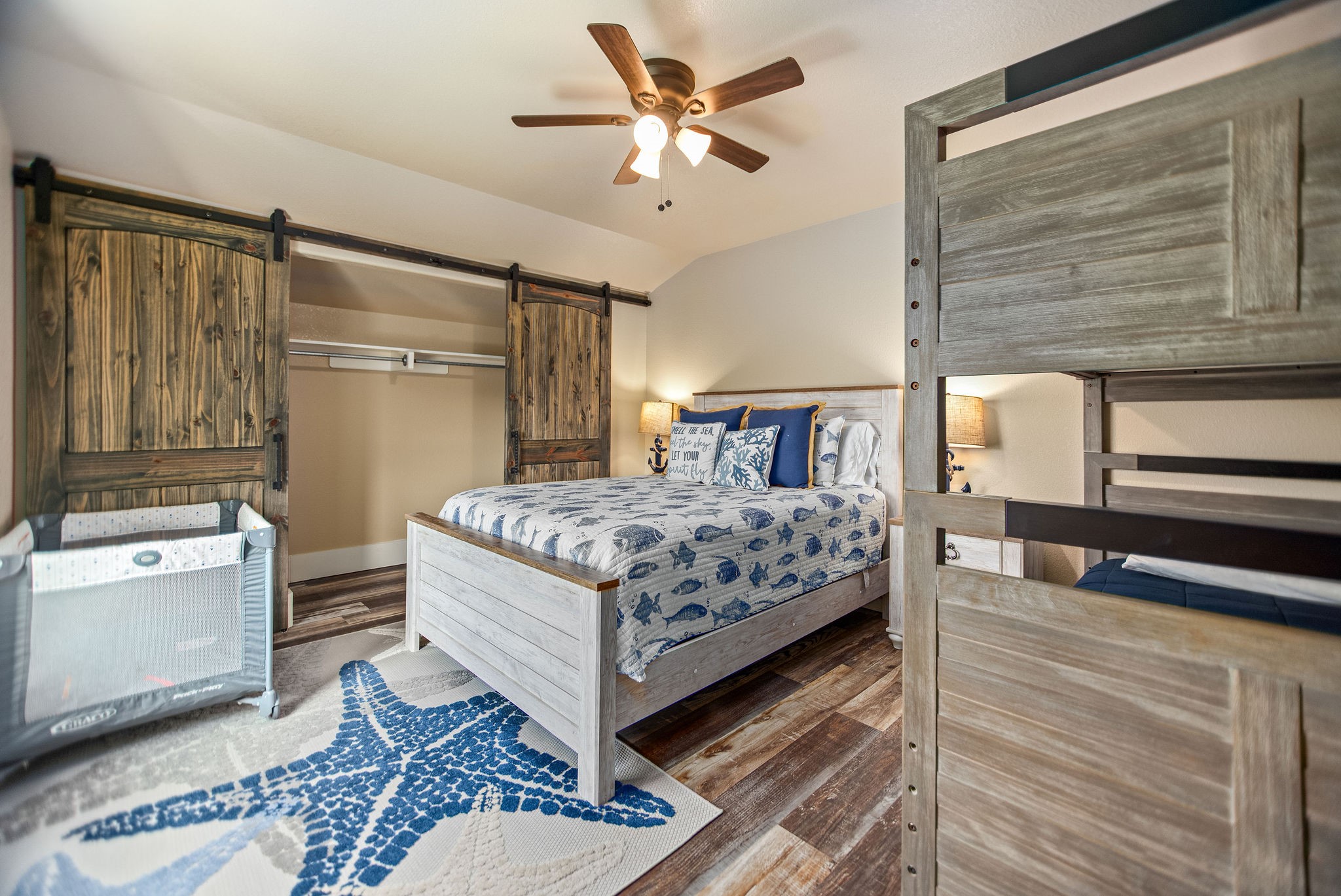 82 Circle Hook Port O'Connor, TX 77982 - Photo 24 of 32 a bedroom with a bed and a dresser with the outer view