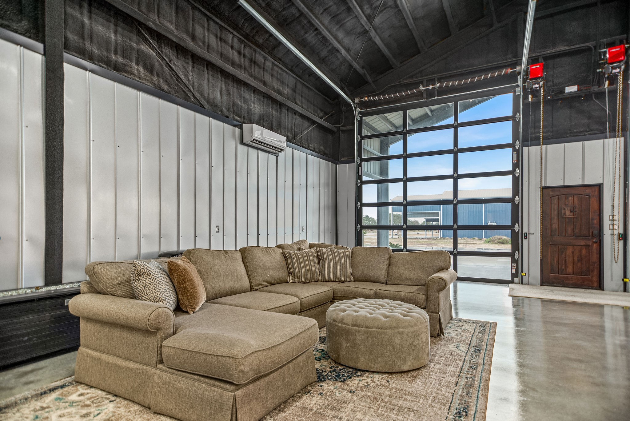 82 Circle Hook Port O'Connor, TX 77982 - Photo 7 of 32 a living room with furniture and a fireplace