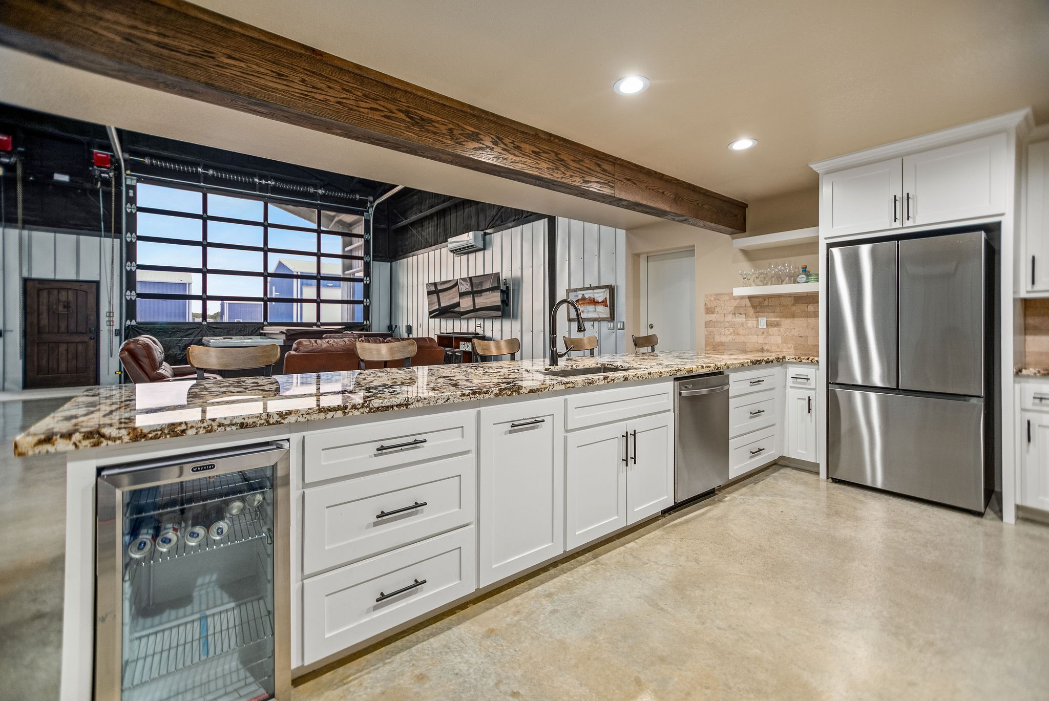 82 Circle Hook Port O'Connor, TX 77982 - Photo 9 of 32 a kitchen that has a lot of white cabinets and stainless steel appliances