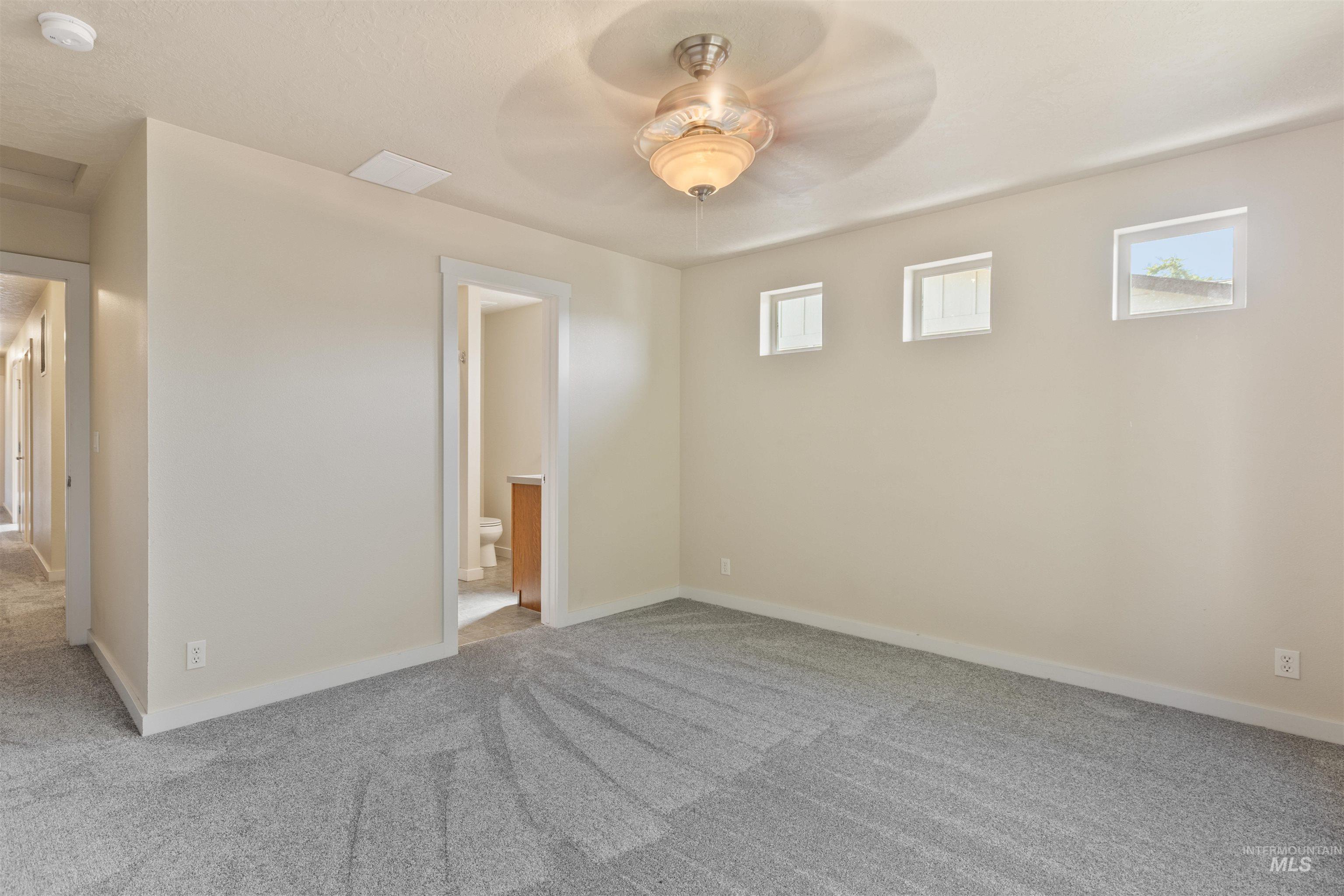 2209 South Amy Avenue Boise, ID 83706 - Photo 20 of 30 Carpeted spare room with a ceiling fan and baseboards