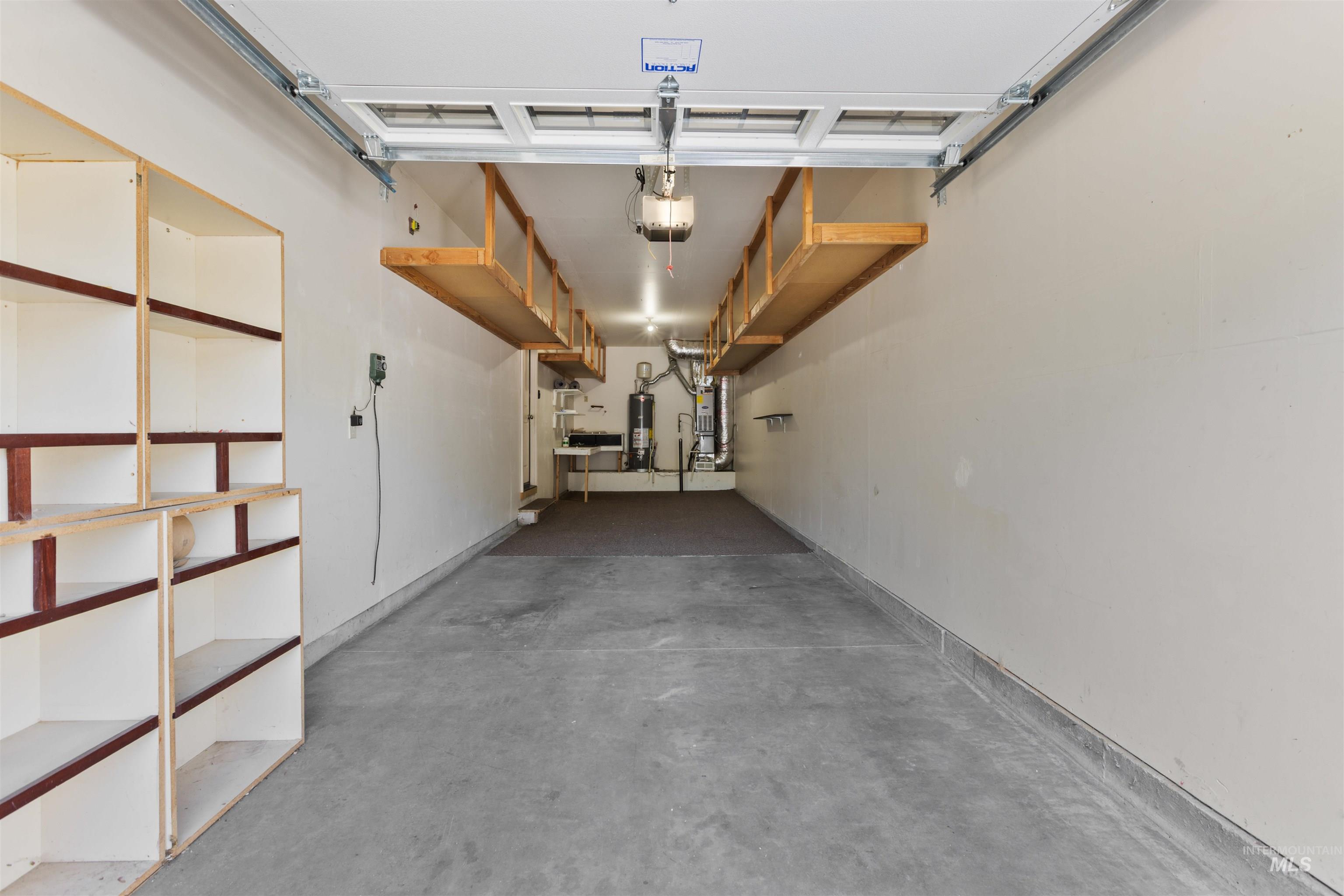2209 South Amy Avenue Boise, ID 83706 - Photo 27 of 30 Garage with water heater and a garage door opener