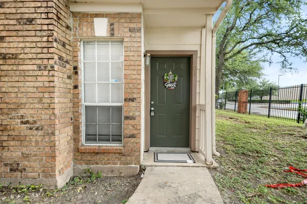 a view of entrance gate of a house