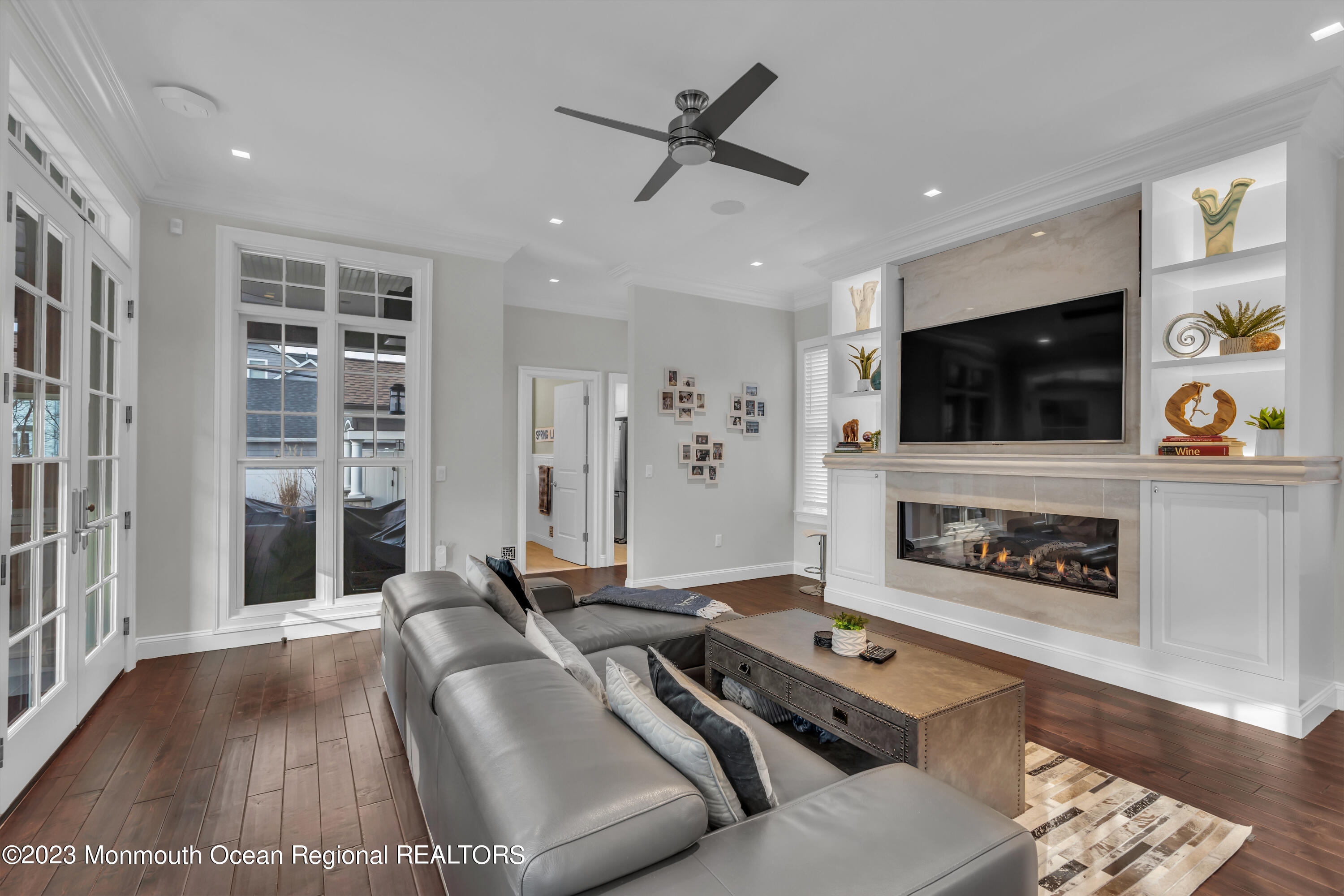 502 Brighton Avenue Spring Lake, NJ 07762 - Photo 21 of 78 a living room with furniture and a flat screen tv