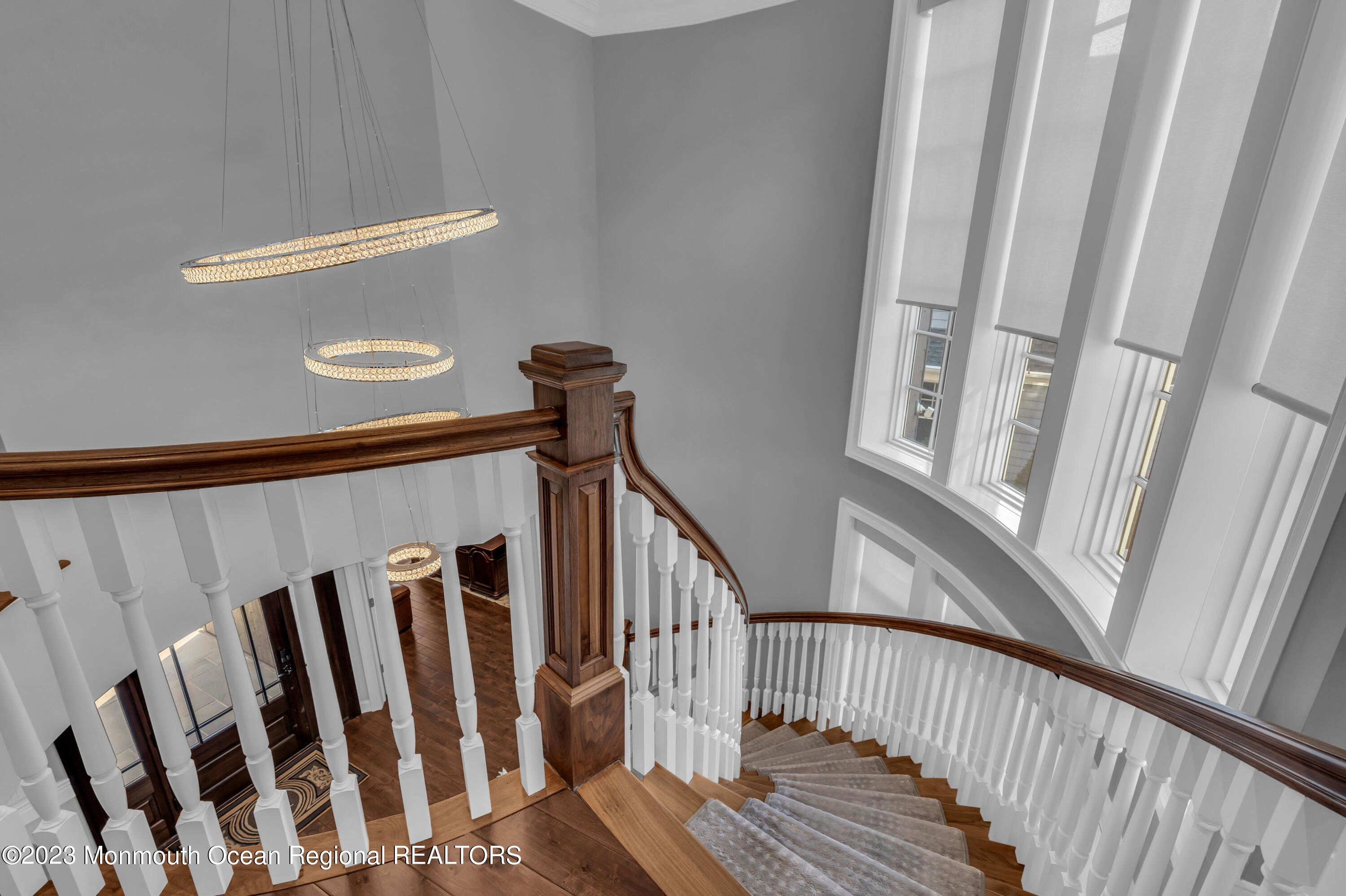502 Brighton Avenue Spring Lake, NJ 07762 - Photo 25 of 78 a view of wooden staircase with railing and white walls
