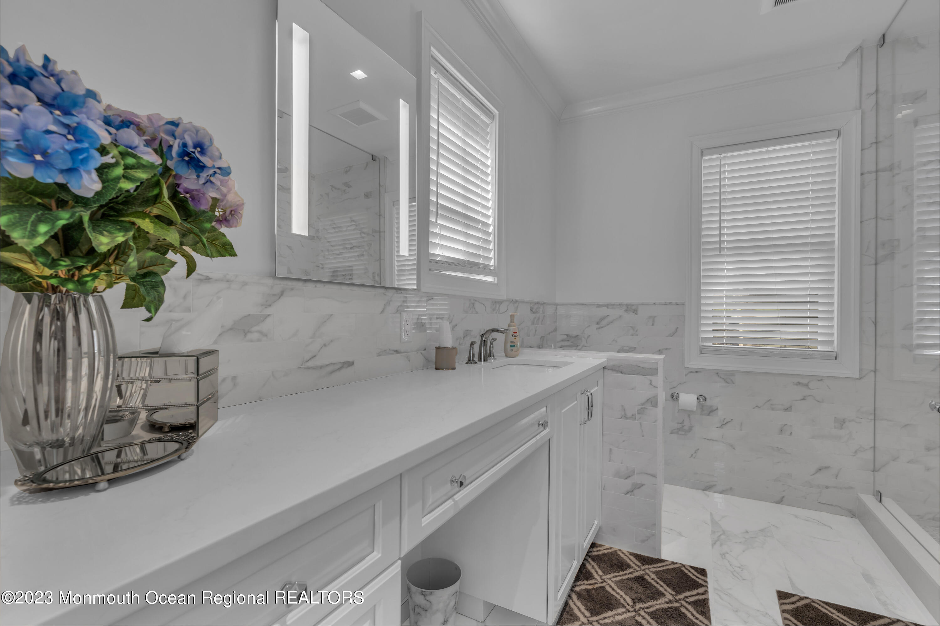 502 Brighton Avenue Spring Lake, NJ 07762 - Photo 27 of 78 a bathroom with a sink a vanity and a mirror