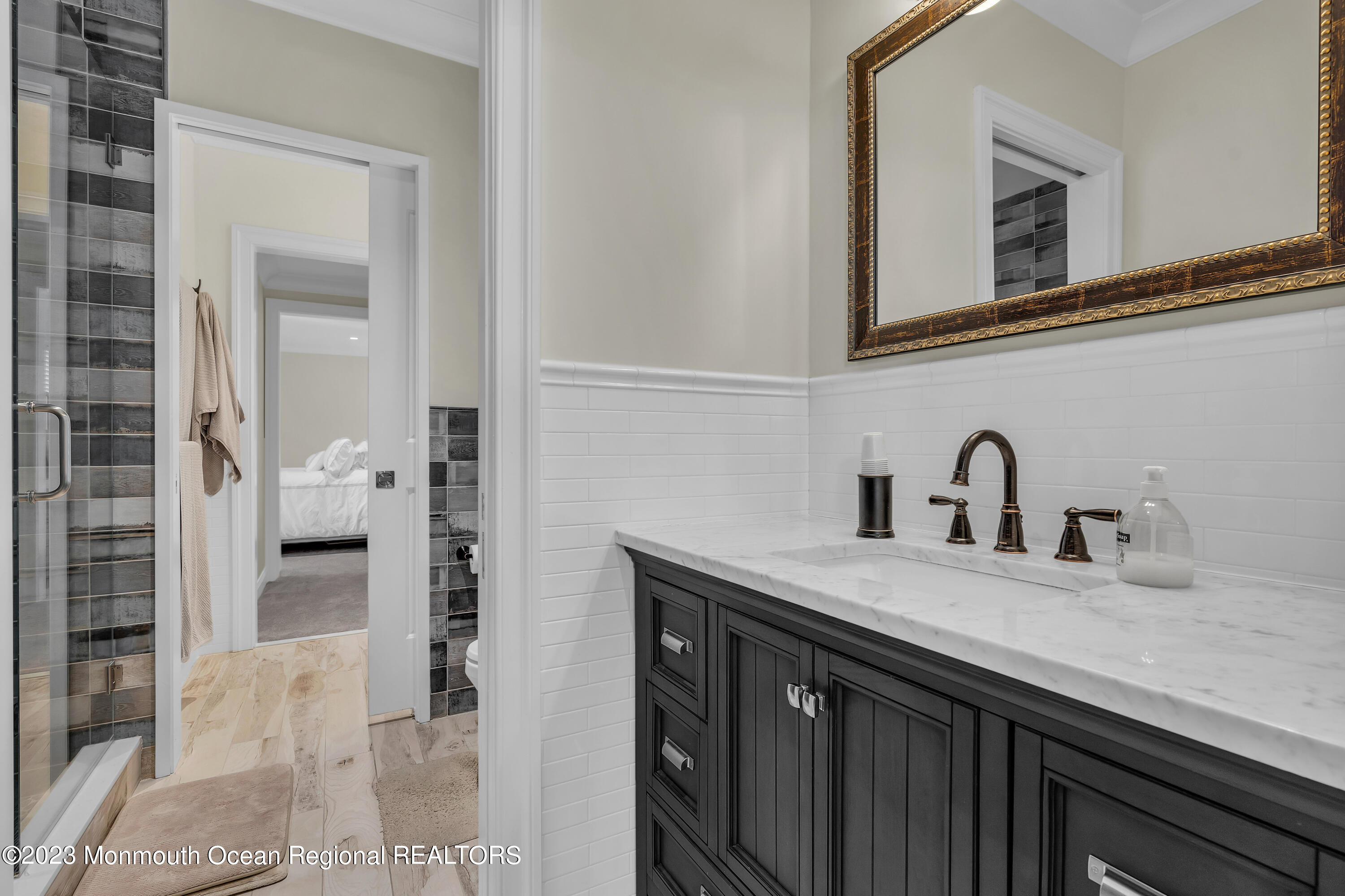 502 Brighton Avenue Spring Lake, NJ 07762 - Photo 30 of 78 a kitchen with a sink and a mirror