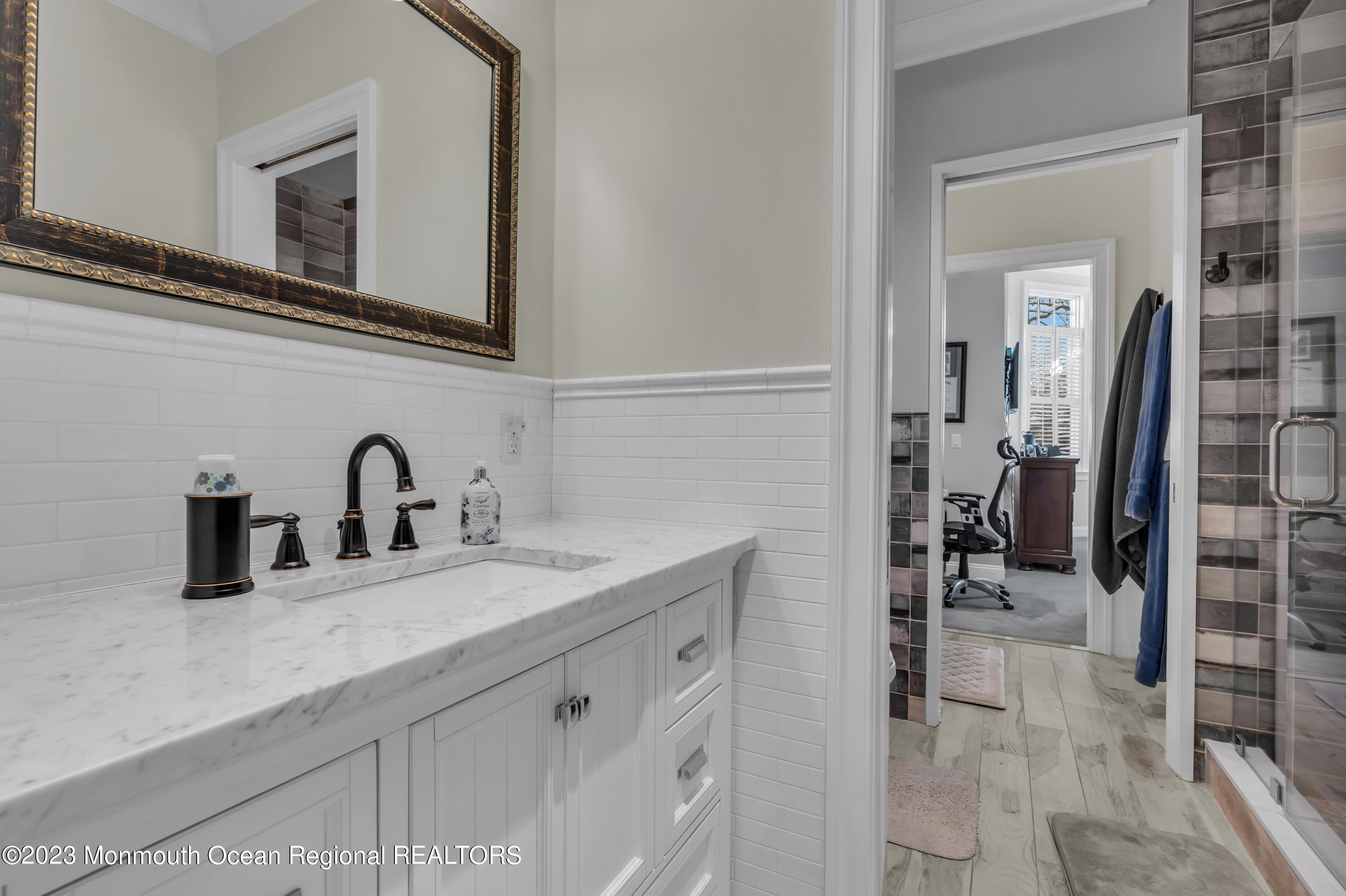 502 Brighton Avenue Spring Lake, NJ 07762 - Photo 31 of 78 a bathroom with a sink and a mirror