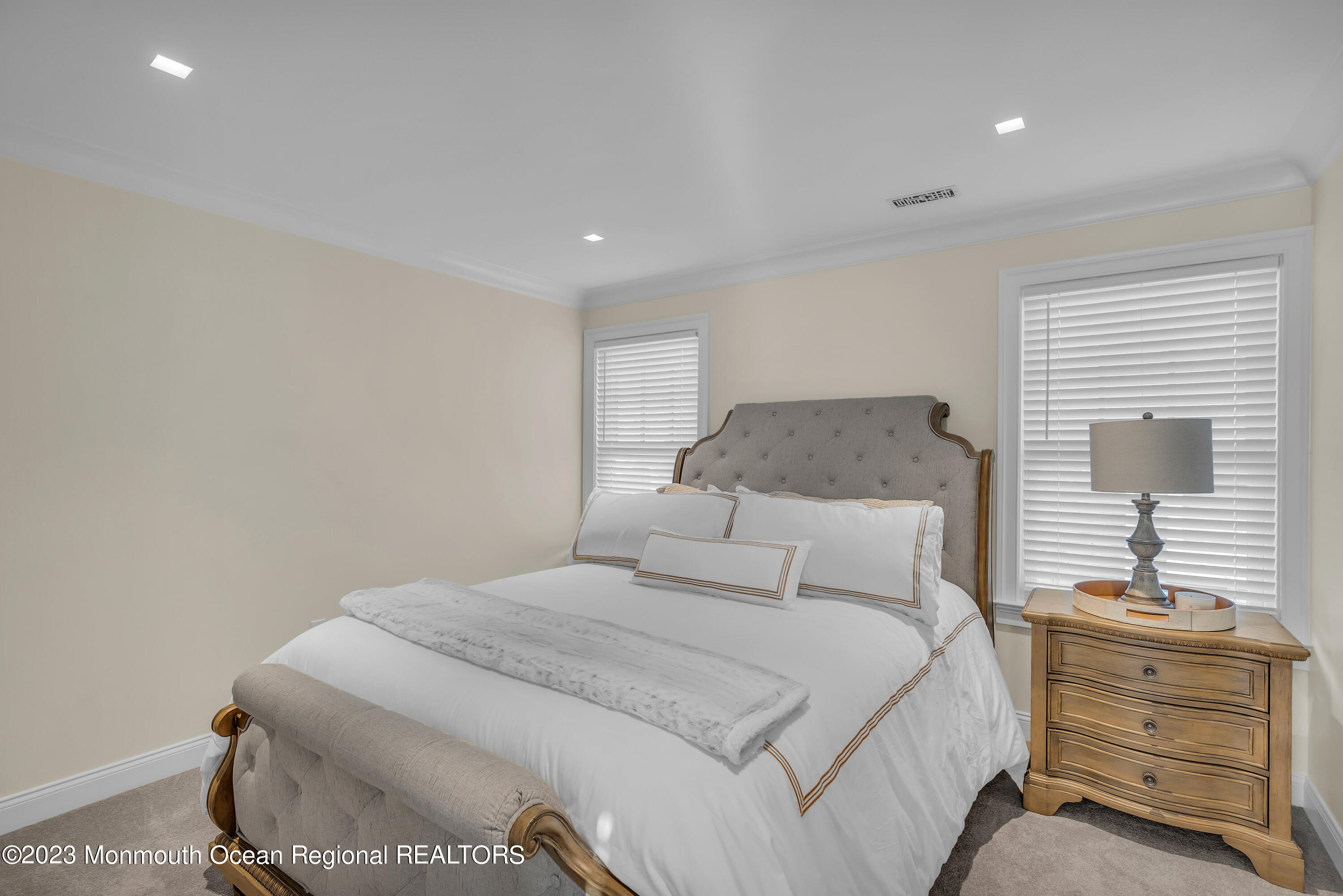 502 Brighton Avenue Spring Lake, NJ 07762 - Photo 34 of 78 a bedroom with a bed and a dresser