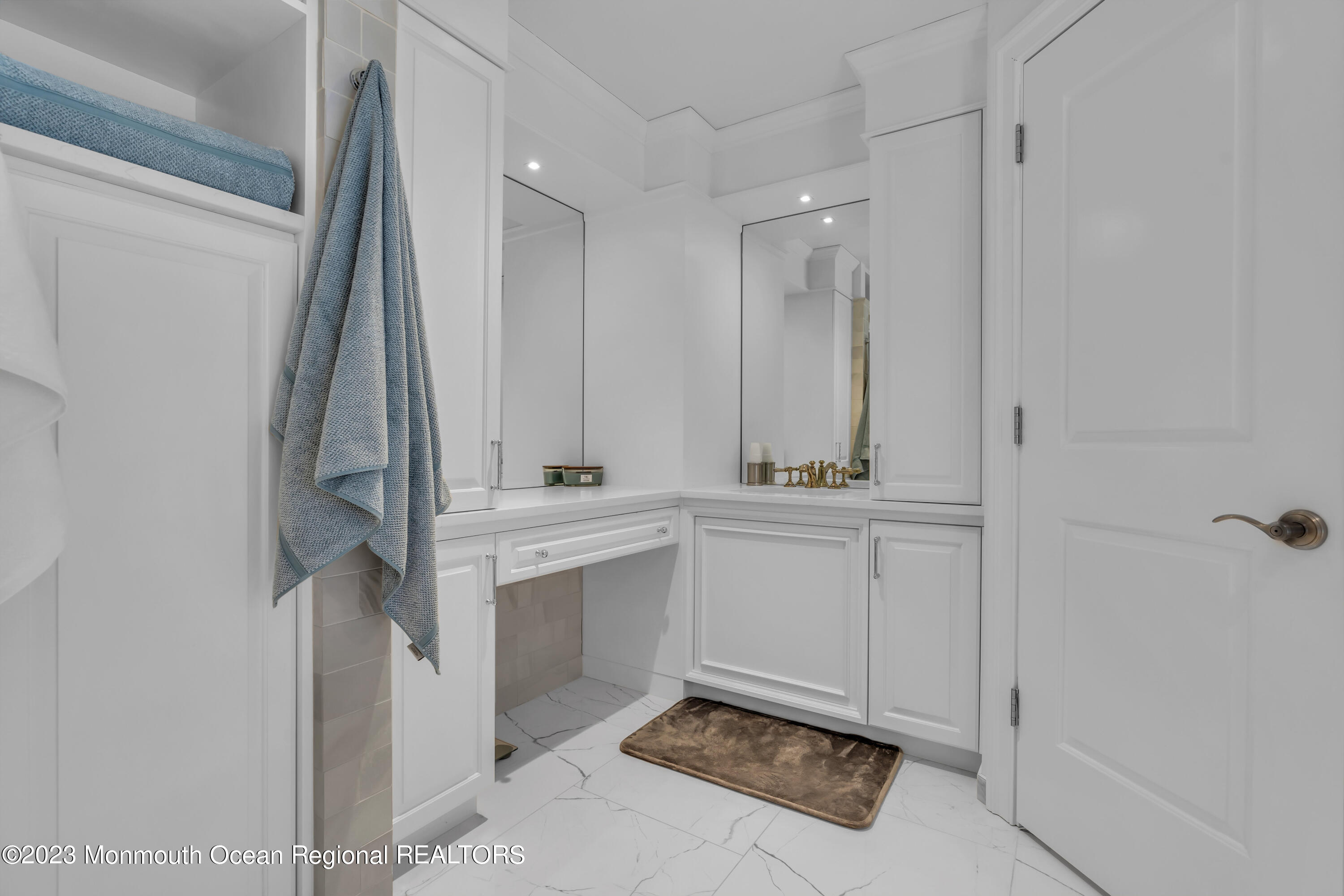 502 Brighton Avenue Spring Lake, NJ 07762 - Photo 37 of 78 a bathroom with a sink and a mirror