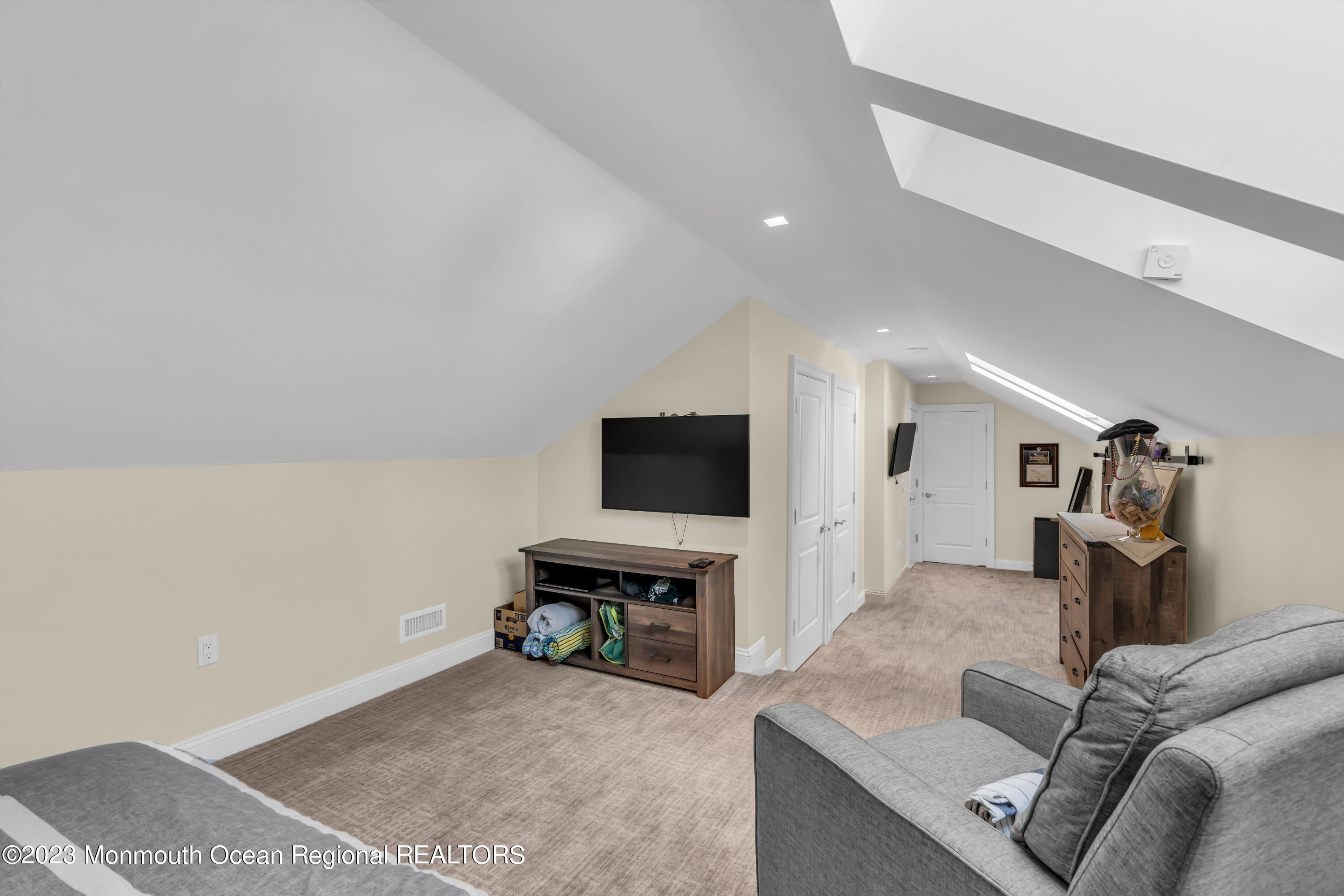 502 Brighton Avenue Spring Lake, NJ 07762 - Photo 50 of 78 a living room with furniture and a flat screen tv