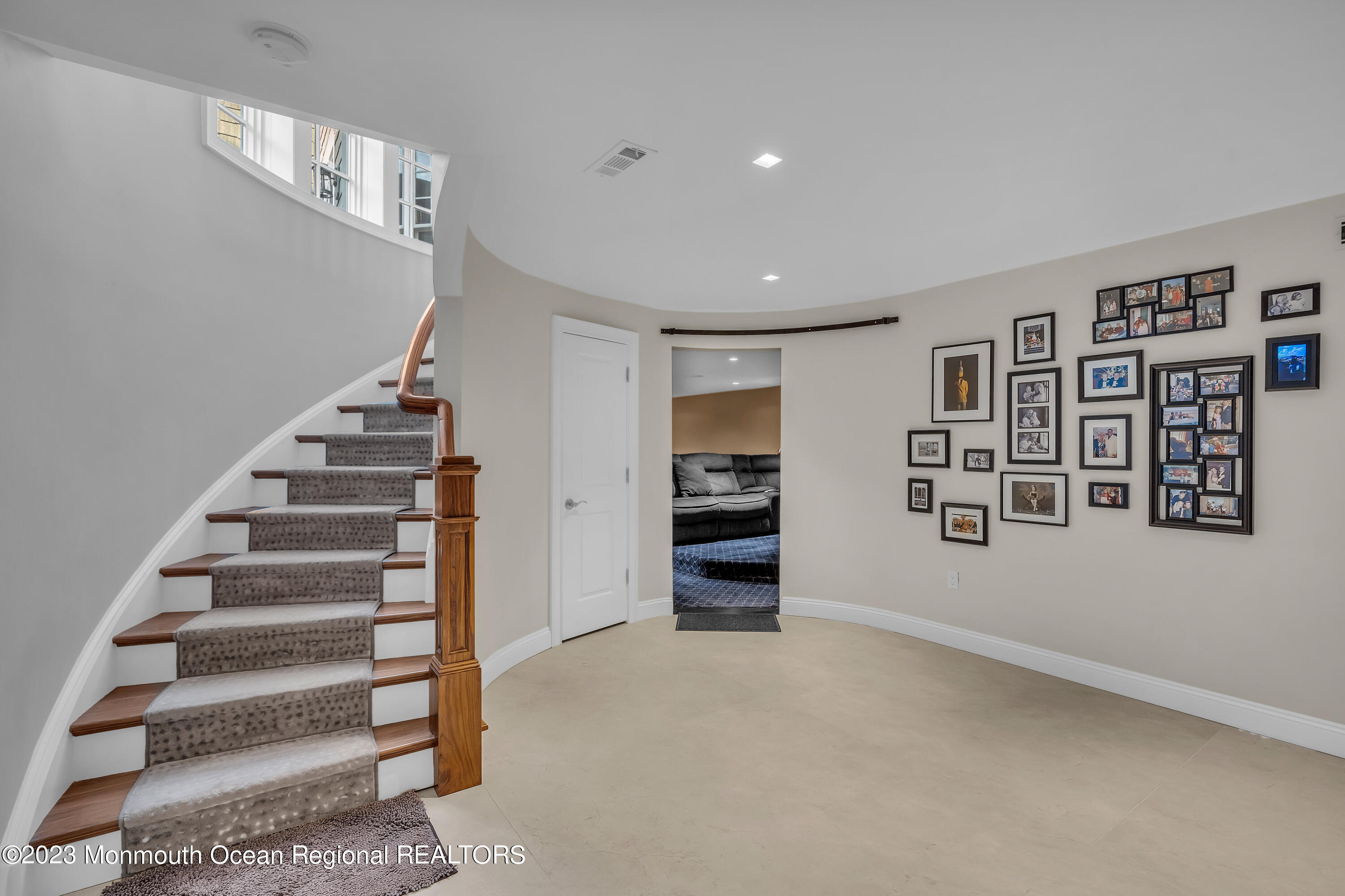 502 Brighton Avenue Spring Lake, NJ 07762 - Photo 51 of 78 a view of an empty room with stairs and a window