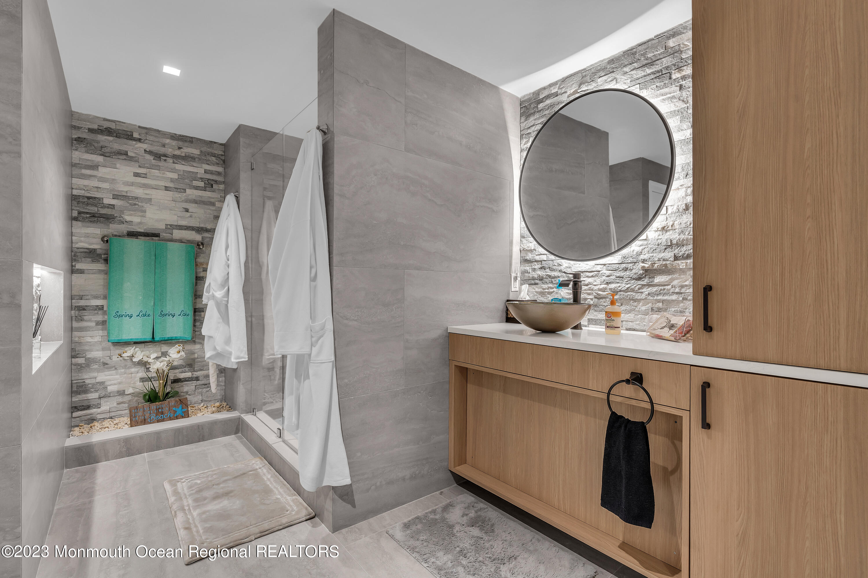 502 Brighton Avenue Spring Lake, NJ 07762 - Photo 53 of 78 a bathroom with a sink a mirror and shower
