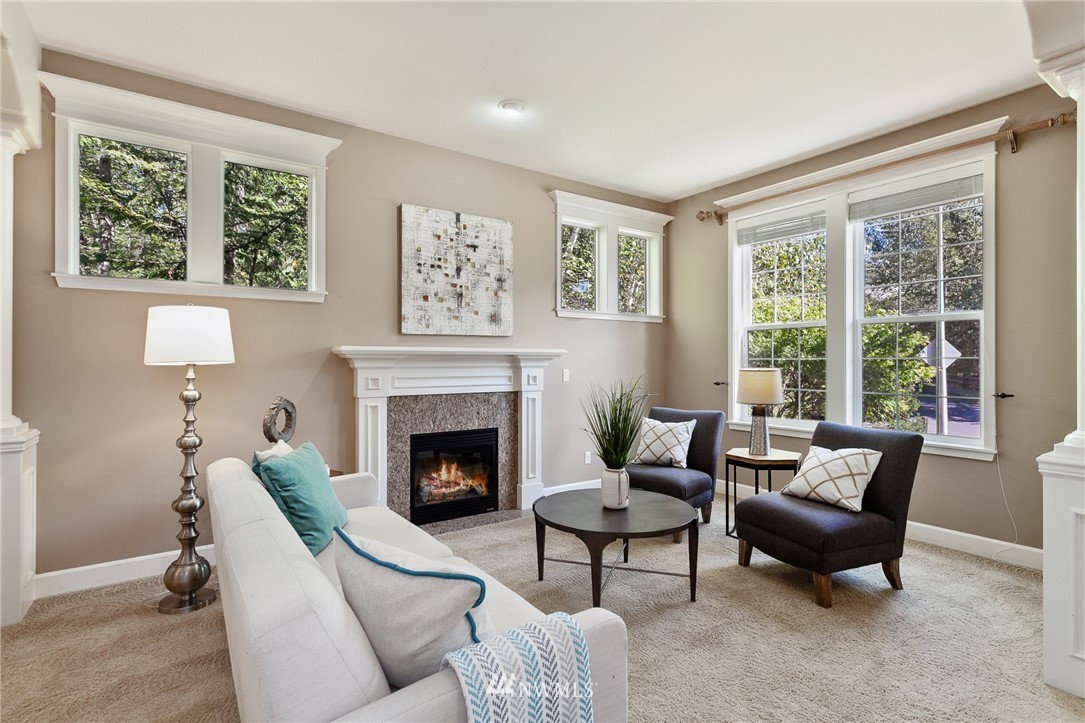 718 South 36th Place Renton, WA 98055 - Photo 2 of 40 a living room with furniture and a fireplace