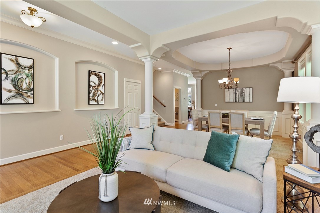 718 South 36th Place Renton, WA 98055 - Photo 3 of 40 a living room with furniture flowerpot and a chandelier
