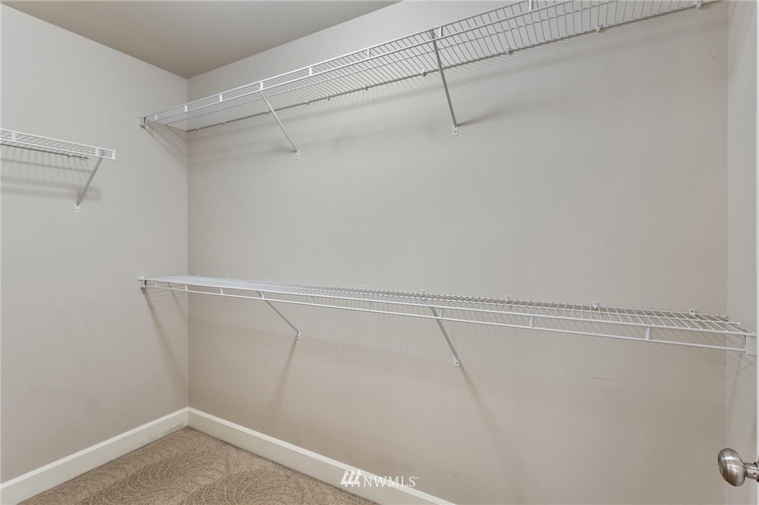 718 South 36th Place Renton, WA 98055 - Photo 24 of 40 a view of a room with racks on the wall