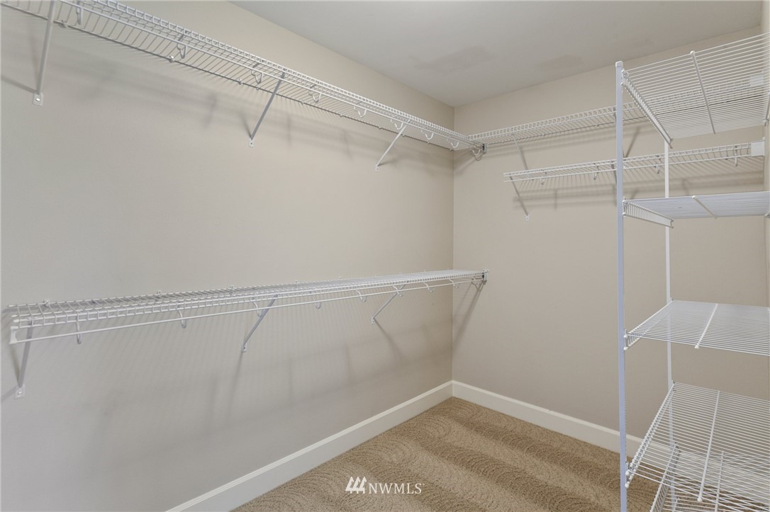 718 South 36th Place Renton, WA 98055 - Photo 25 of 40 a view of a room with racks on the wall