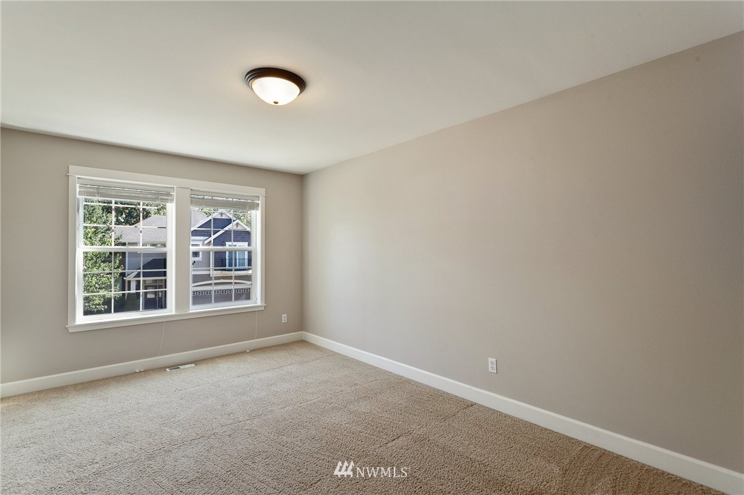 718 South 36th Place Renton, WA 98055 - Photo 27 of 40 an empty room with a window