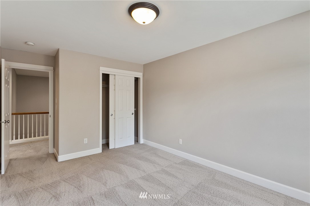 718 South 36th Place Renton, WA 98055 - Photo 29 of 40 an empty room with sliding door