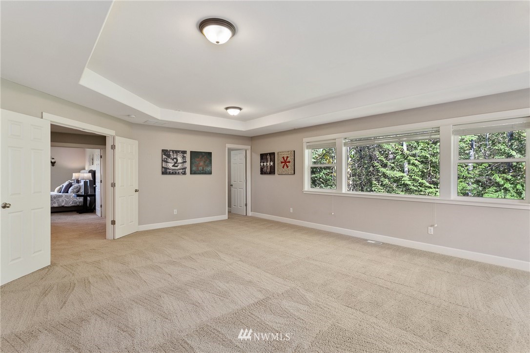 718 South 36th Place Renton, WA 98055 - Photo 31 of 40 a view of a livingroom with a window and workspace