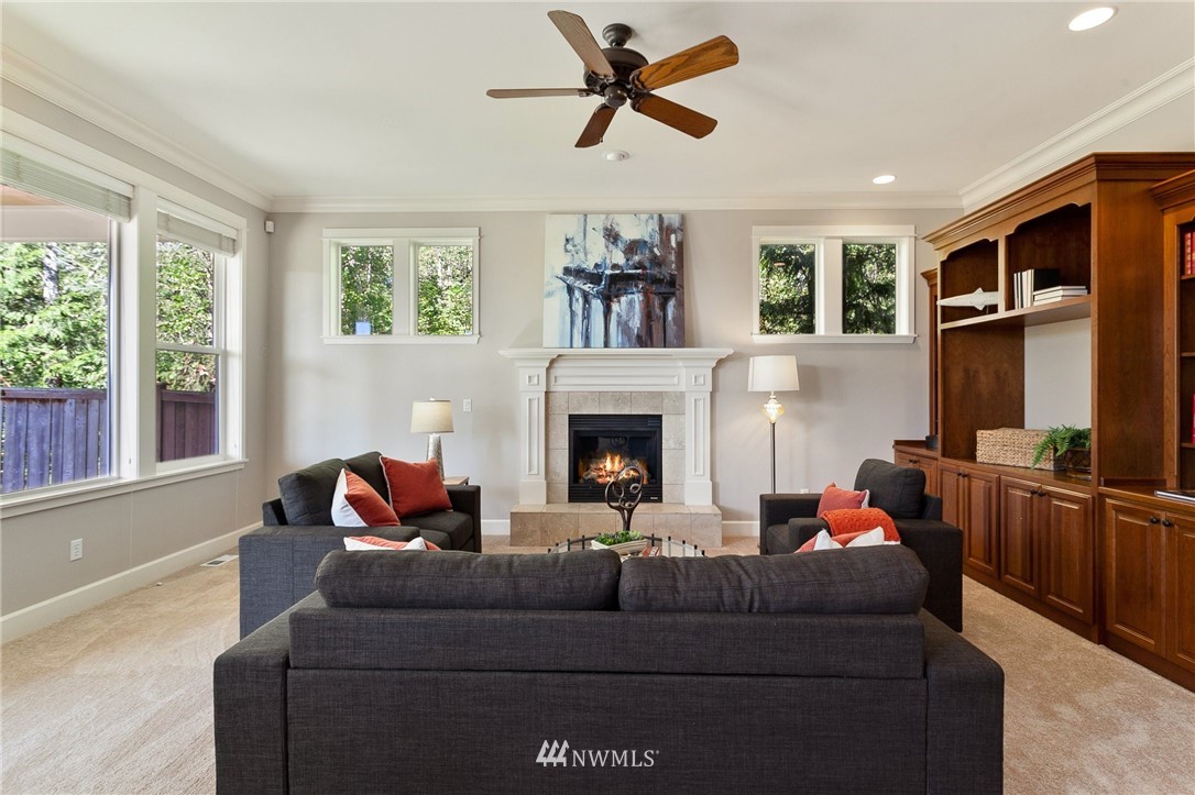 718 South 36th Place Renton, WA 98055 - Photo 7 of 40 a living room with furniture and a fireplace