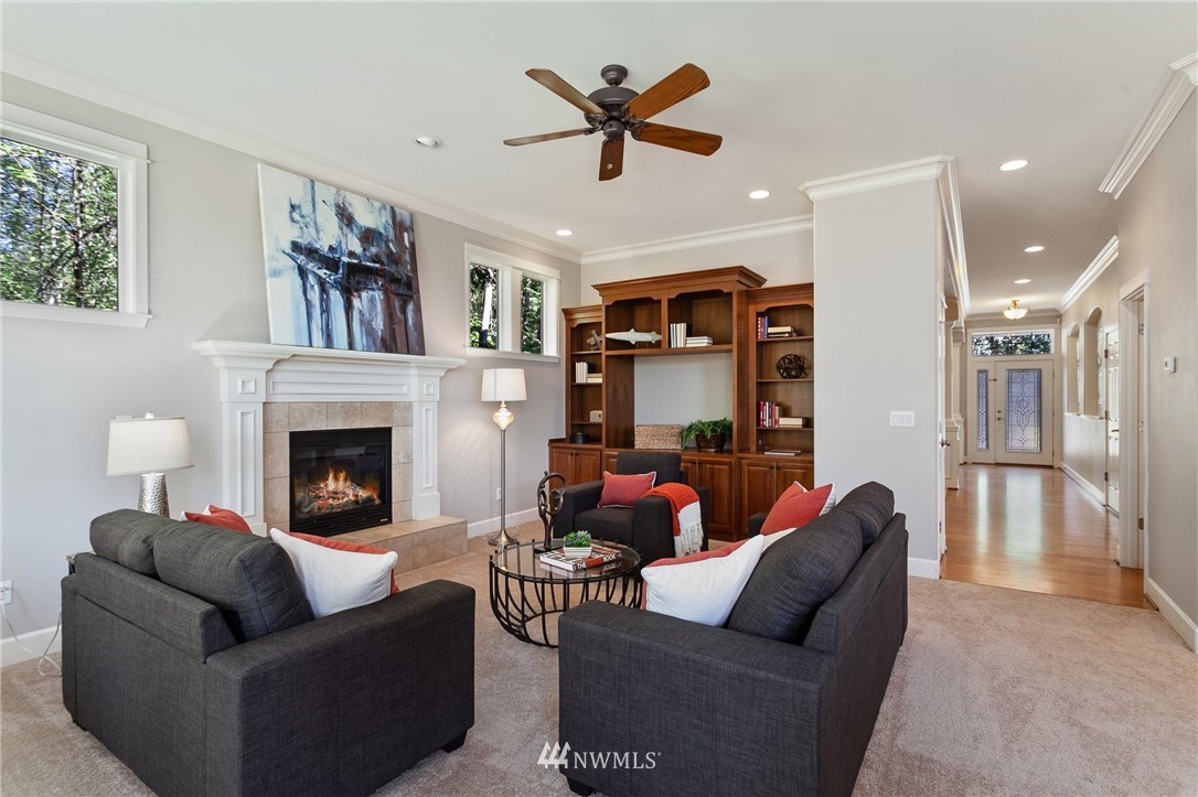 718 South 36th Place Renton, WA 98055 - Photo 8 of 40 a living room with furniture and a fireplace