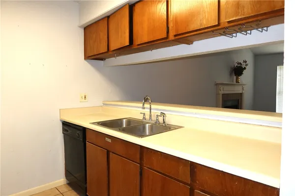 a kitchen with a sink and cabinets
