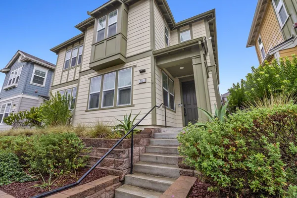 front view of a house with a small yard