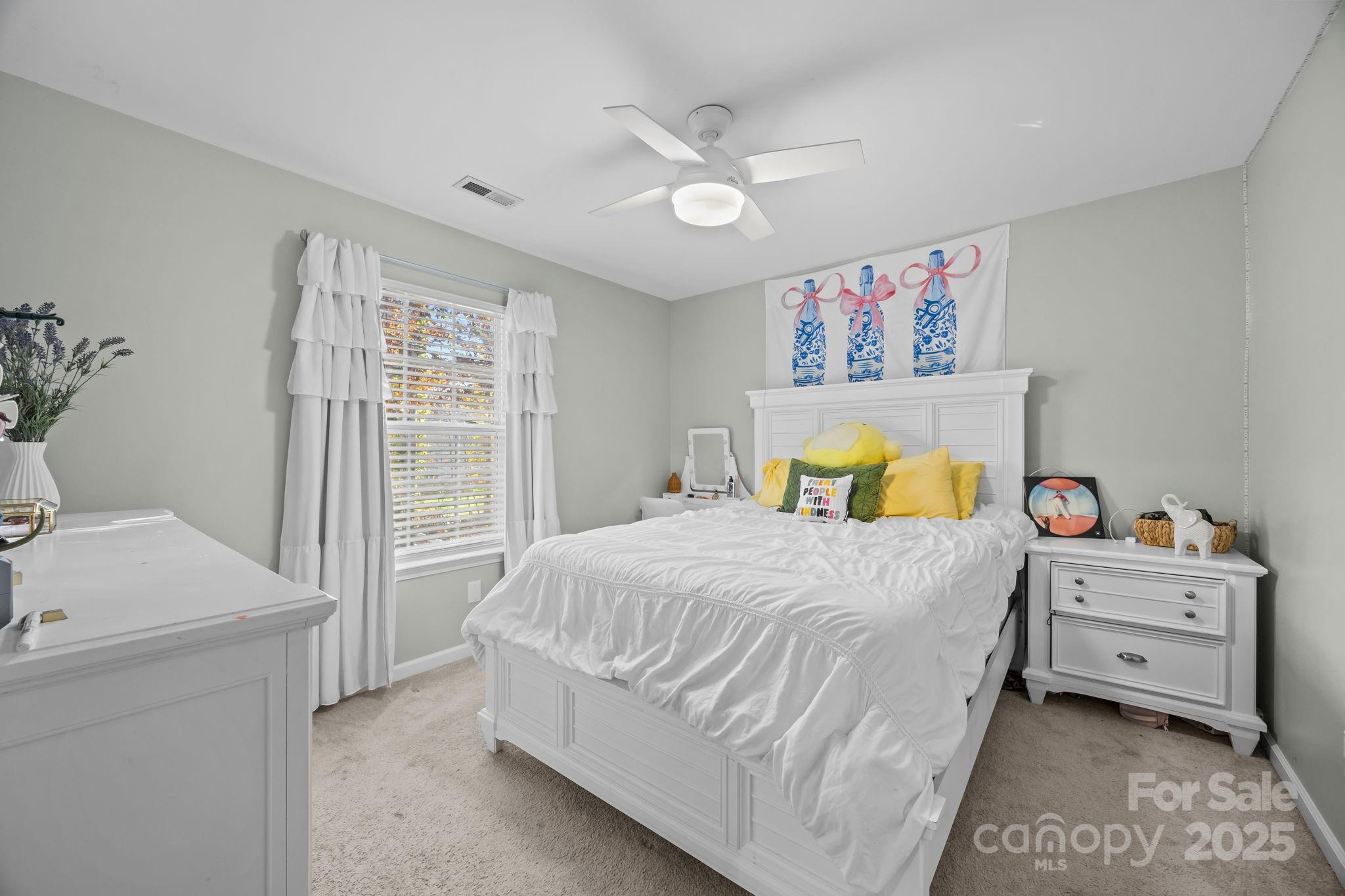 135 Shade Tree Circle Fort Mill, SC 29715 - Photo 19 of 34 a bedroom with a bed and a window