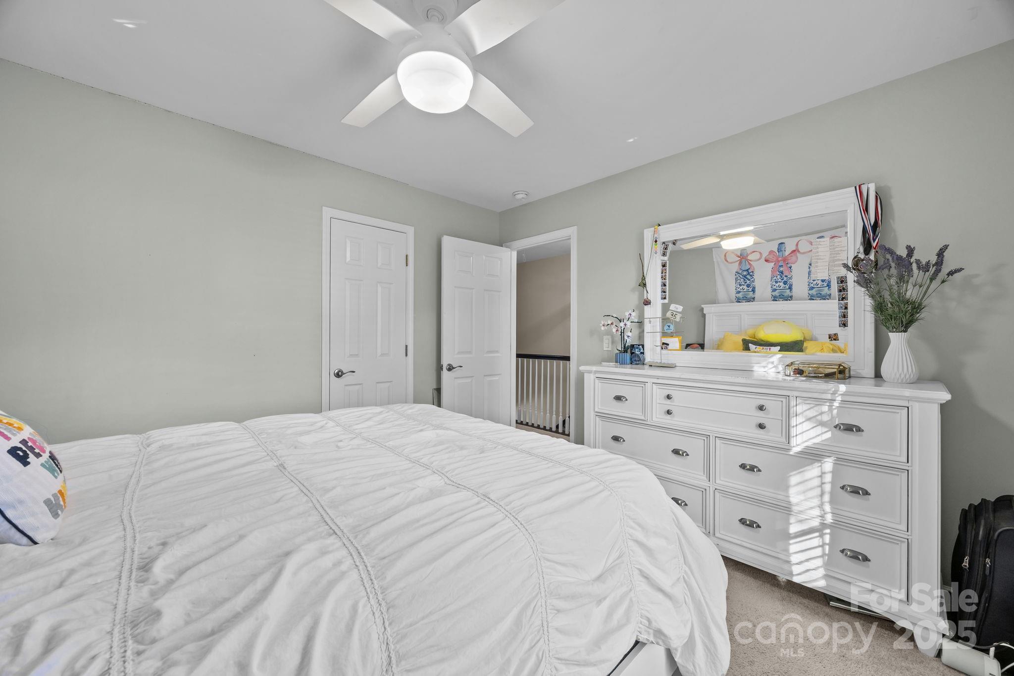 135 Shade Tree Circle Fort Mill, SC 29715 - Photo 20 of 34 a bedroom with a bed and a dresser in it