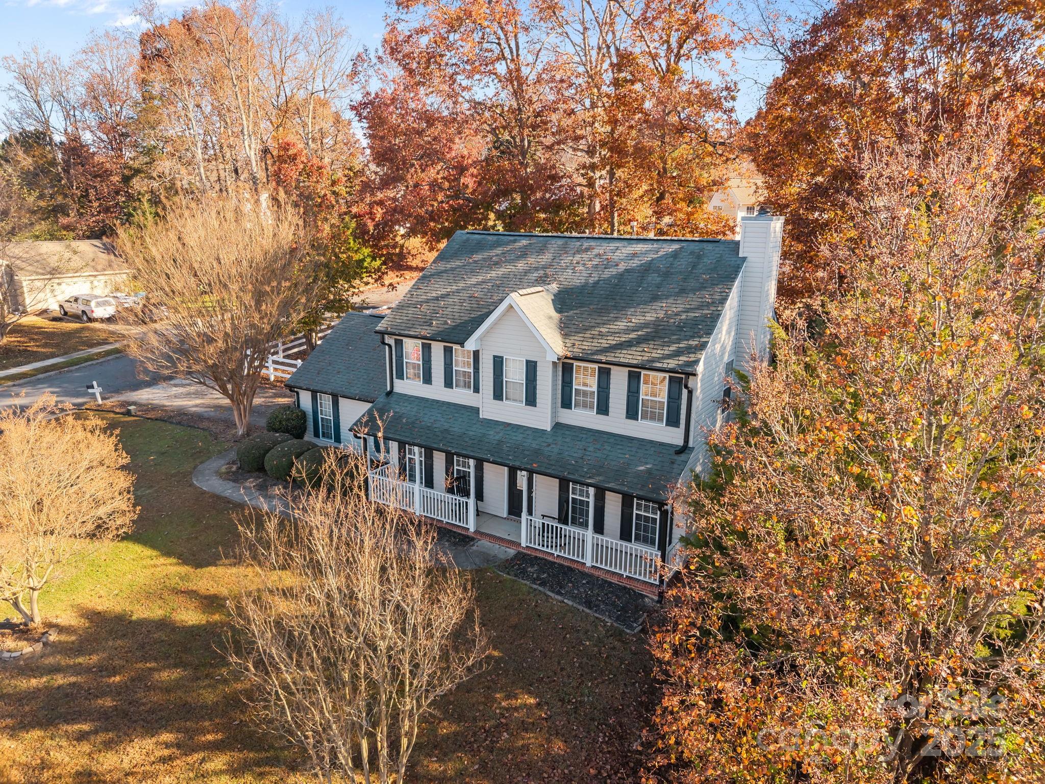 135 Shade Tree Circle Fort Mill, SC 29715 - Photo 2 of 34 a backyard of a house with large trees