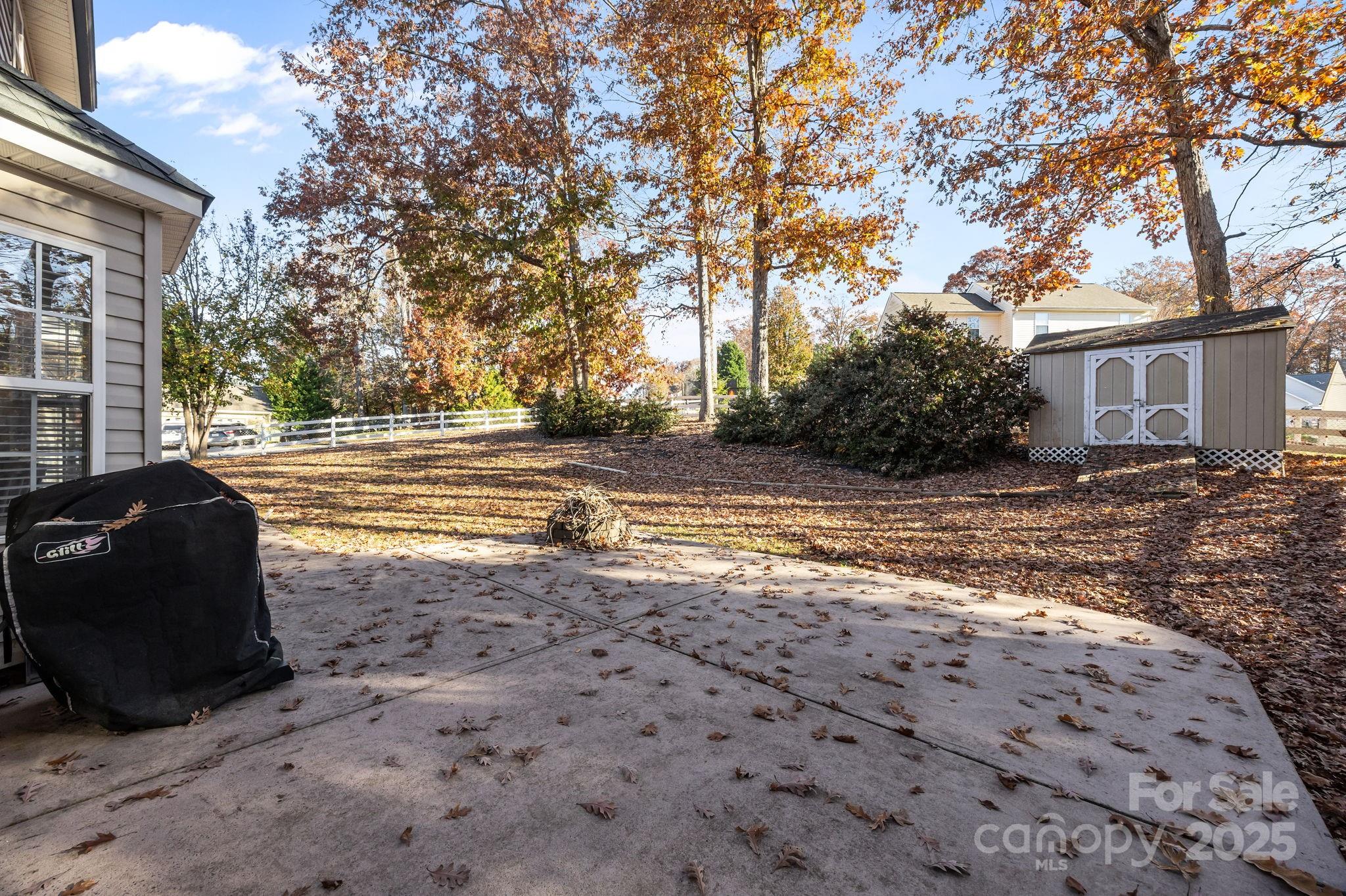 135 Shade Tree Circle Fort Mill, SC 29715 - Photo 23 of 34 a view of a house with backyard and trees