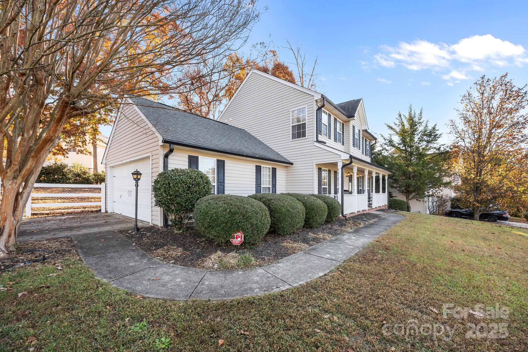 135 Shade Tree Circle Fort Mill, SC 29715 - Photo 30 of 34 a front view of a house with a yard