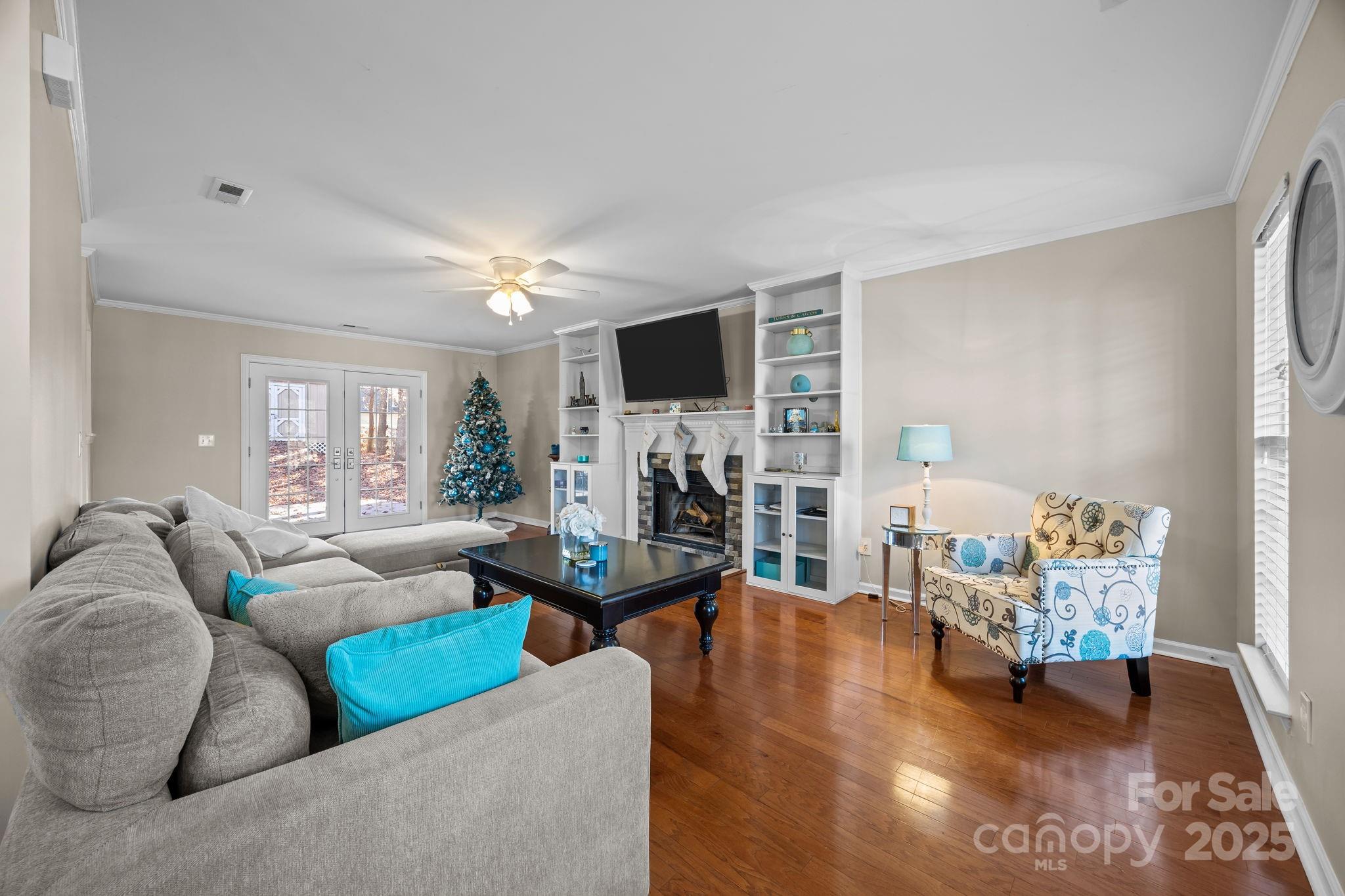135 Shade Tree Circle Fort Mill, SC 29715 - Photo 3 of 34 a living room with furniture and a flat screen tv