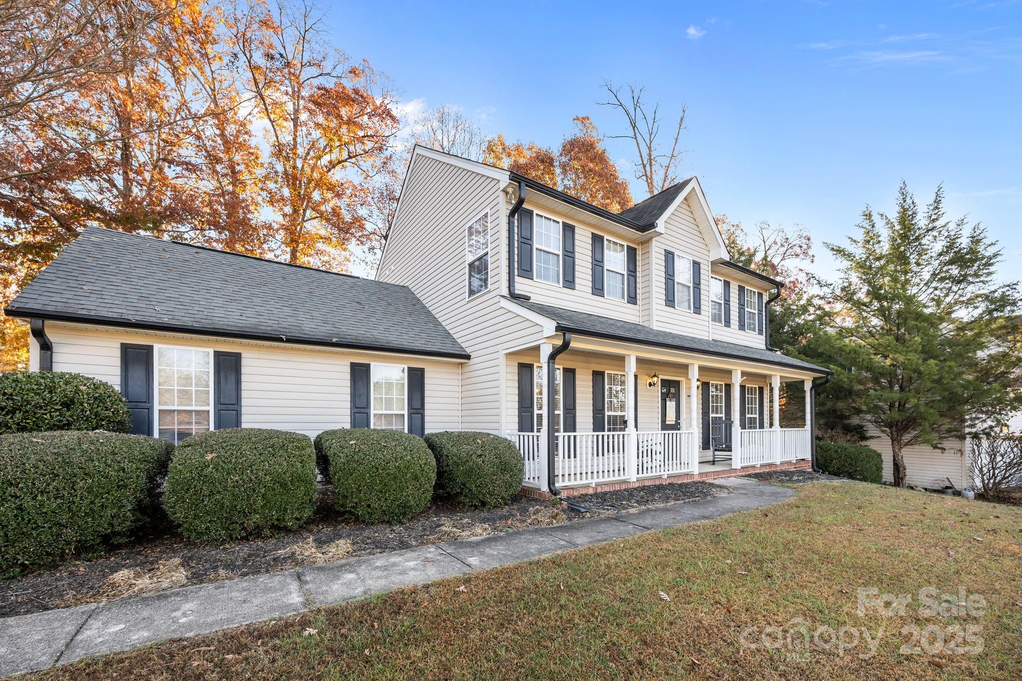 135 Shade Tree Circle Fort Mill, SC 29715 - Photo 31 of 34 a front view of a house with a garden