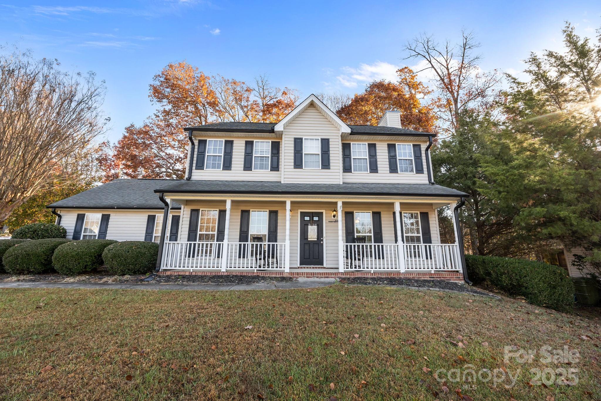 135 Shade Tree Circle Fort Mill, SC 29715 - Photo 32 of 34 a front view of a house with garden