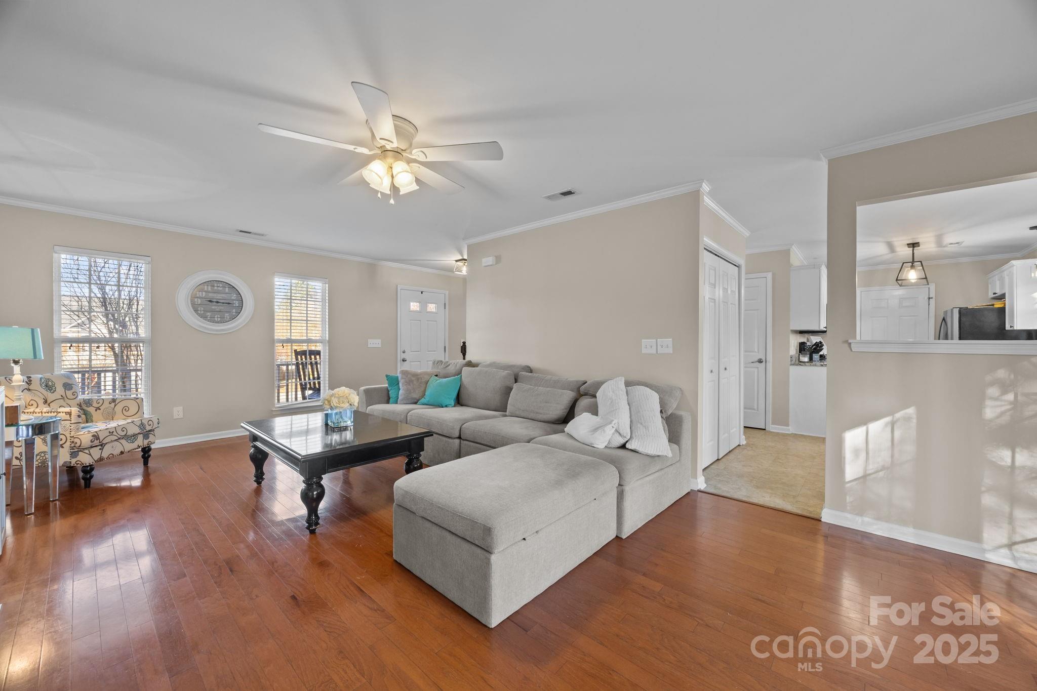 135 Shade Tree Circle Fort Mill, SC 29715 - Photo 5 of 34 a living room with furniture and wooden floor