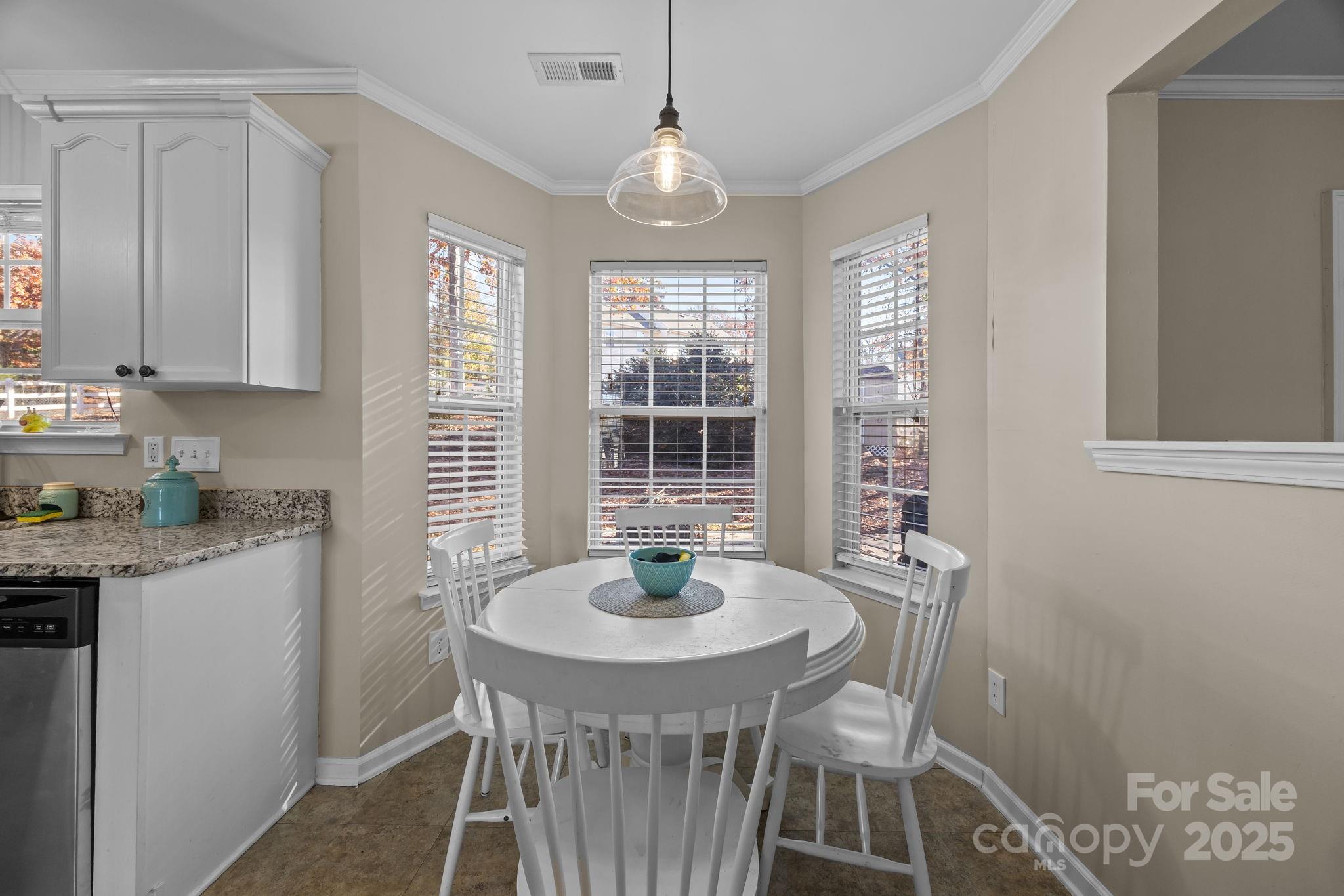 135 Shade Tree Circle Fort Mill, SC 29715 - Photo 7 of 34 a dining room with furniture and window