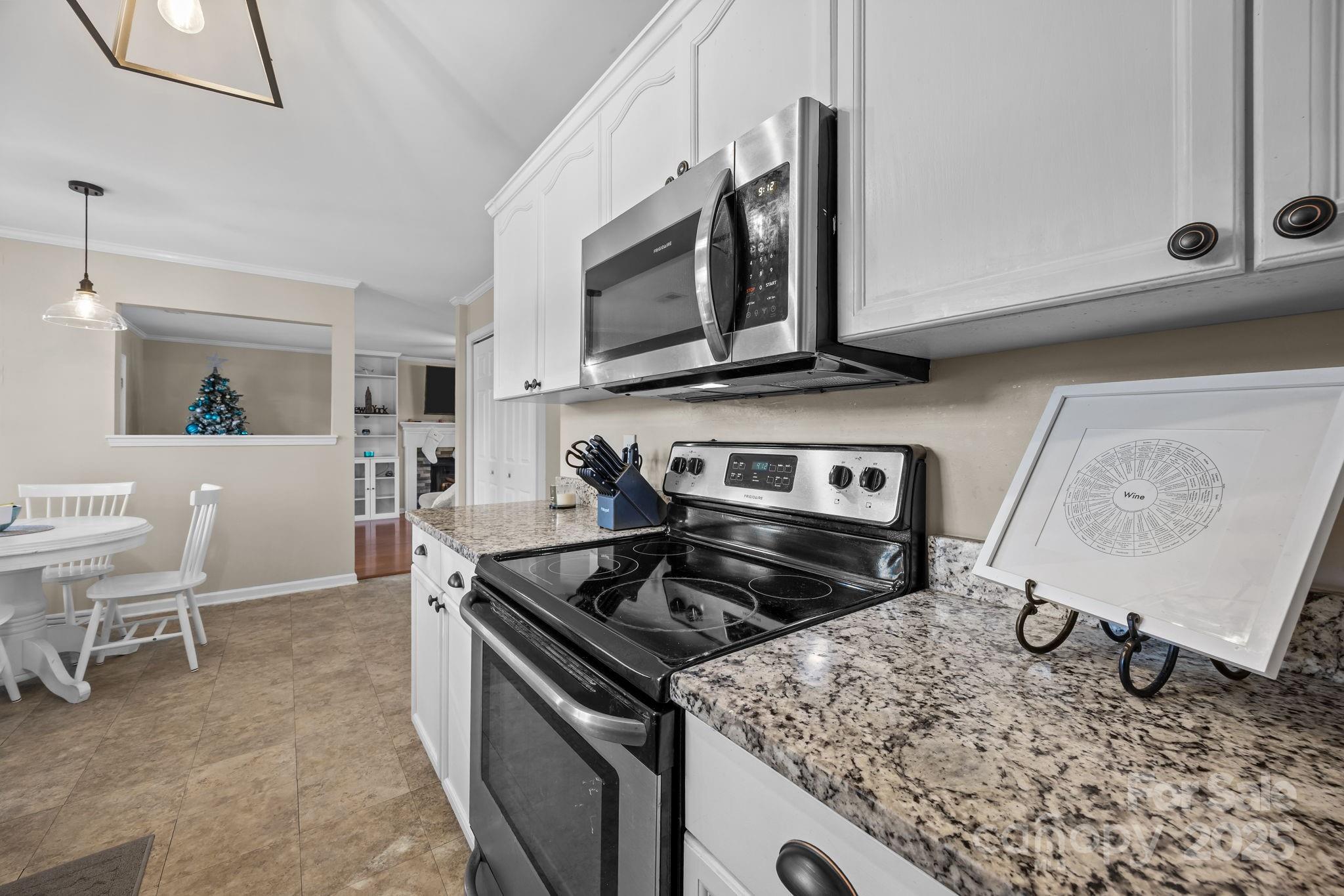 135 Shade Tree Circle Fort Mill, SC 29715 - Photo 9 of 34 a kitchen with a stove and a microwave