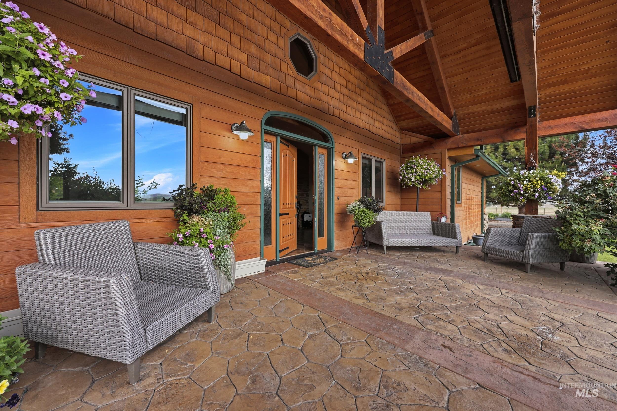 339 Airport Road Weiser, ID 83672 - Photo 4 of 49 Covered patio featuring a stamped concrete surface with accent banding