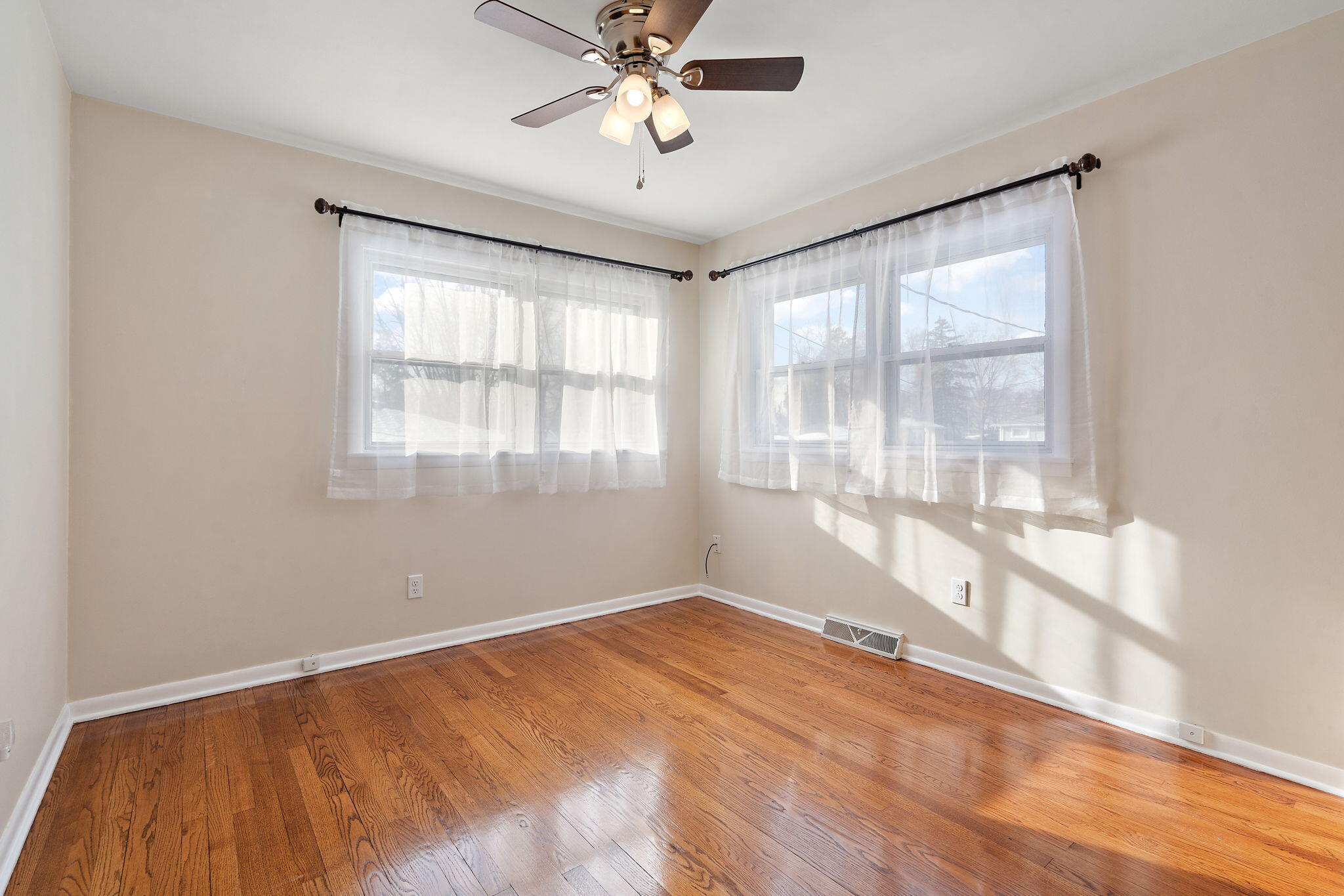 8228 Rutledge Street Merrillville, IN 46410 - Photo 16 of 32 a view of an empty room with a window