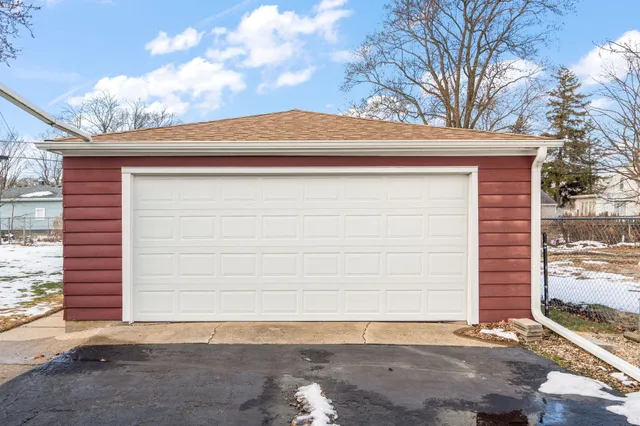 a side view of a house with a yard