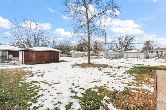 a view of snow on the side of the road