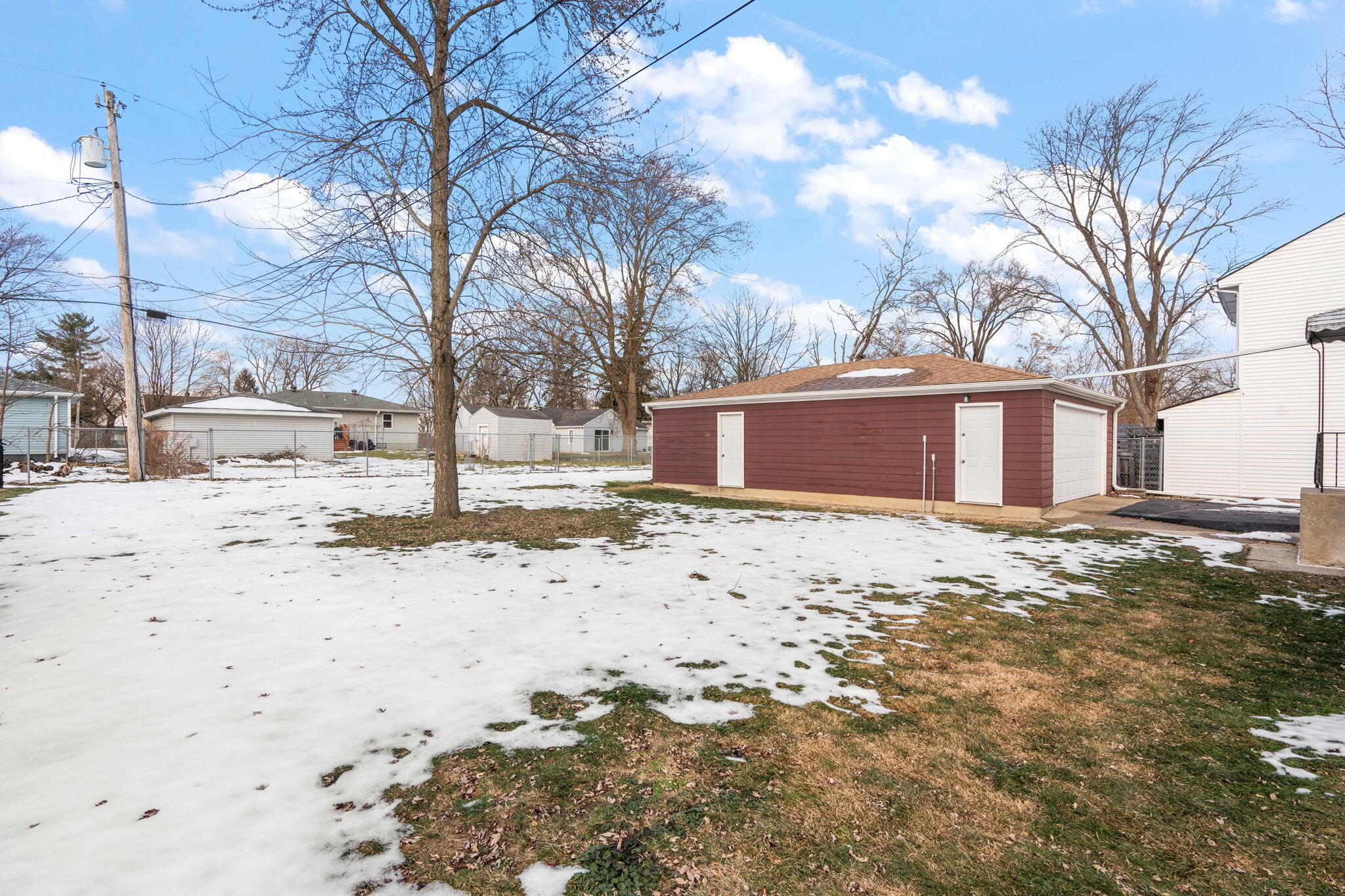 8228 Rutledge Street Merrillville, IN 46410 - Photo 30 of 32 a view of a yard with snow on the road