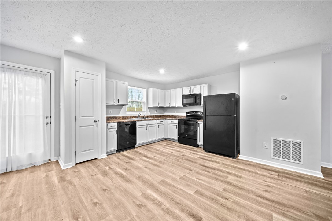 226 Golden Gate Avenue Springfield, OH 45506 - Photo 8 of 20 This bright kitchen features modern appliances and ample space for daily living.