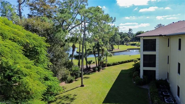 an aerial view of a houses with a yard