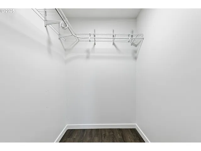 a view of storage and utility room with racks on the wall